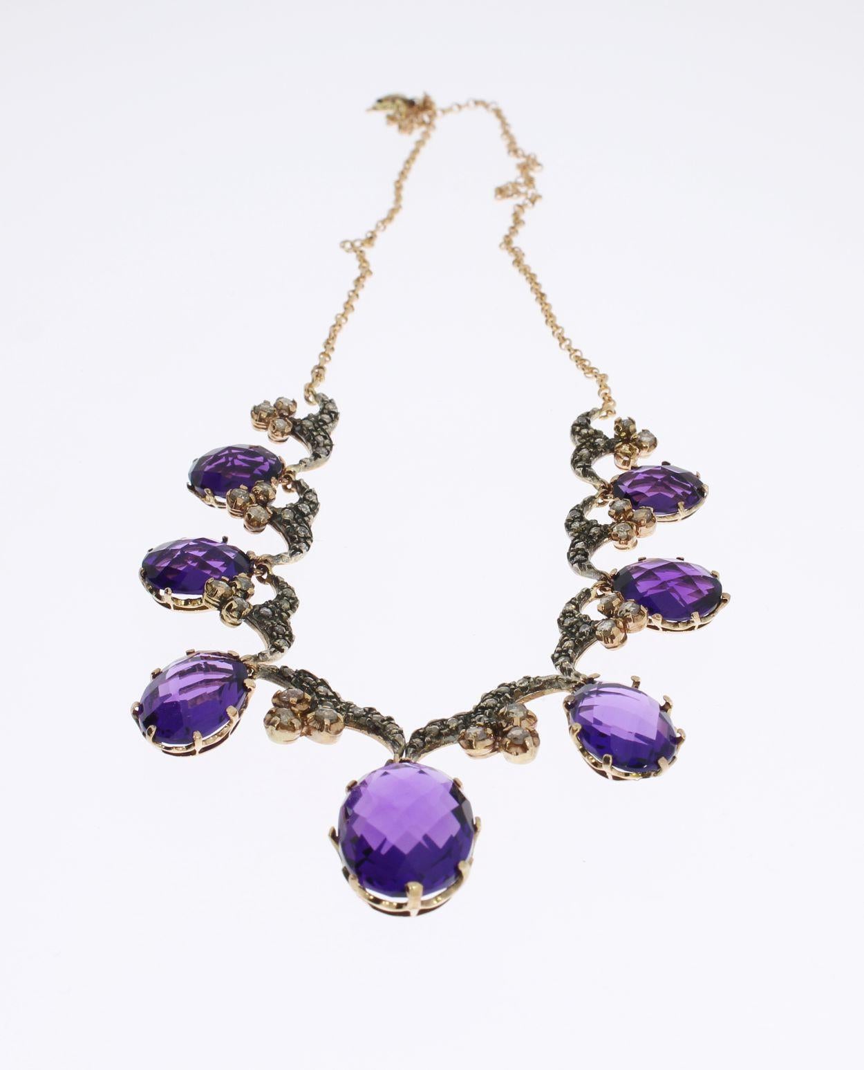 gold necklace with purple stone