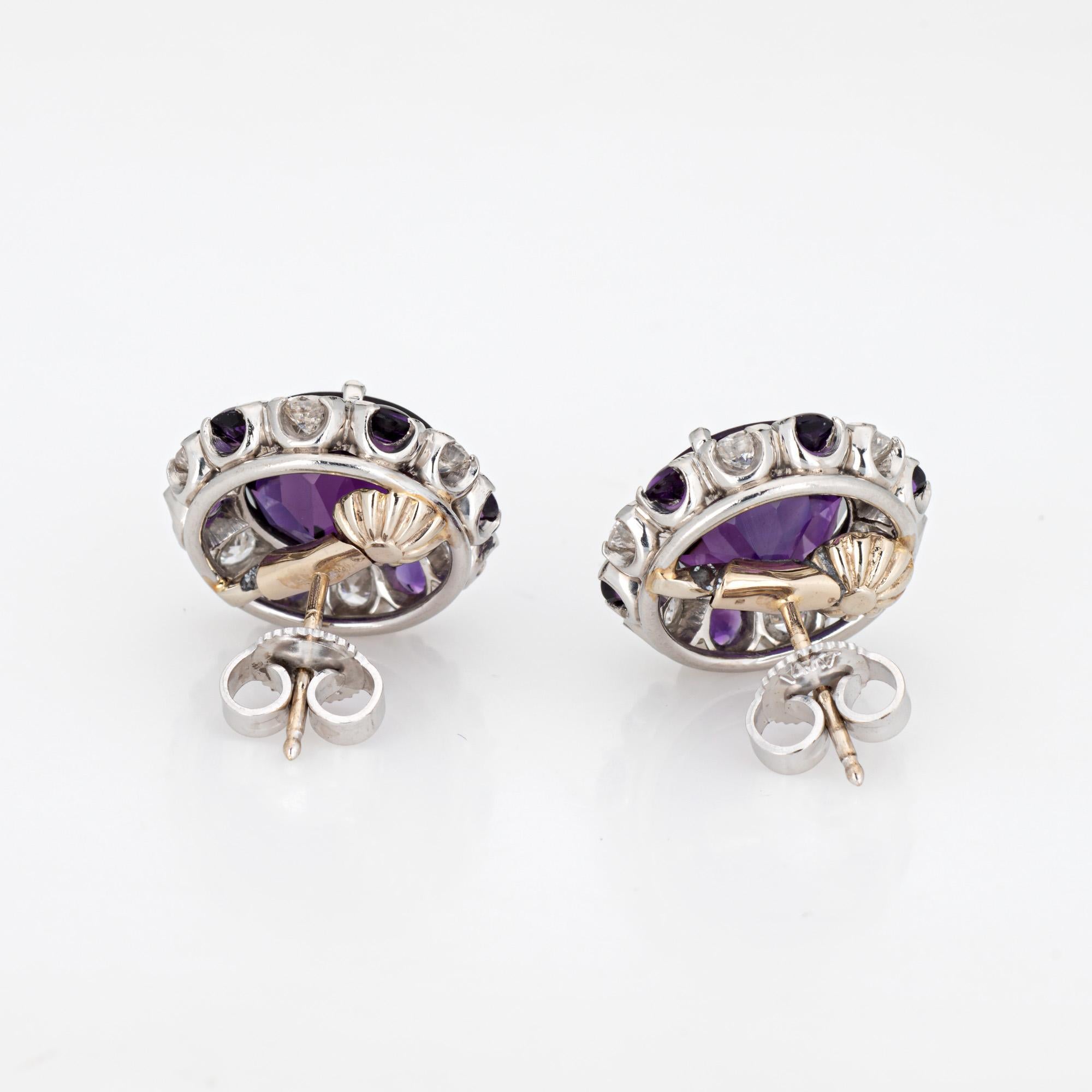 Elegant pair of vintage amethyst & diamond stud earrings crafted in 900 platinum and 14k white gold.  

Cabochon cut center set amethysts measure 9mm with accenting smaller amethysts measuring 2mm. Round brilliant cut diamonds total an estimated