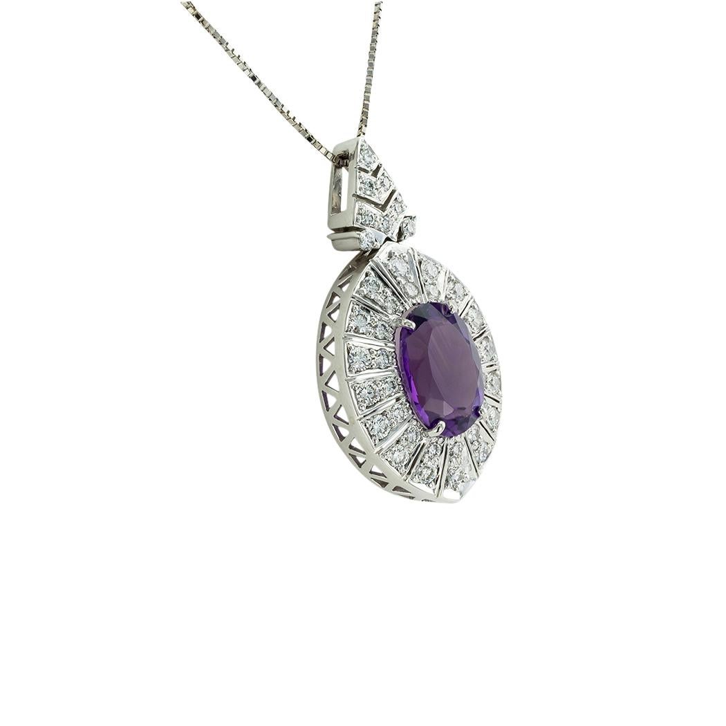 Amethyst and diamond white gold pendant necklace circa 1990. *

ABOUT THIS ITEM:  #P-DJ621C. Scroll down for detailed specifications.  The amethyst in this pendant displays a rich and vibrant color that is seen in fine-quality amethyst.  Gliding on