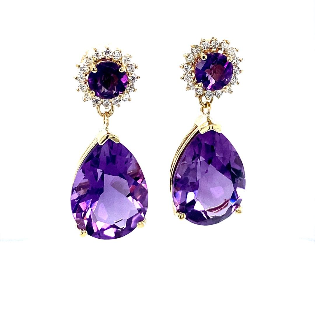 Amethyst and Diamond Drop Earrings! 

These stunning Earrings have 2 large Pear Cut Amethysts that weigh 18.91 Carats and and 2 Round Cut Amethysts that weigh 1.59 Carats.  The Round cut Amethysts are embellished with 32 Round Cut Diamonds that
