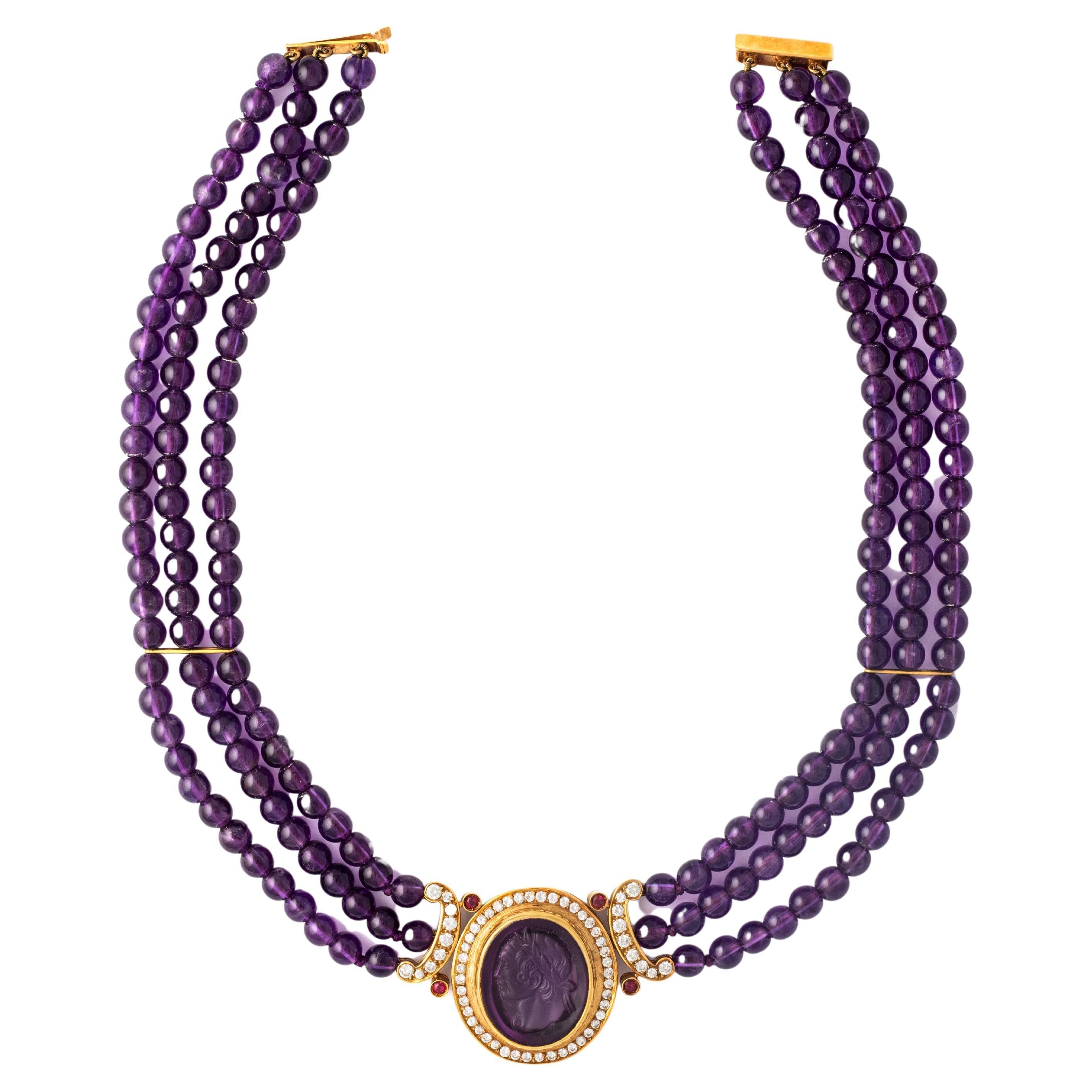 Amethyst beads, diamond and yellow gold necklace holding a central cameo amethyst pendant.

Total length: approx. 37.5 centimeters.

Pendant width: 4.00 centimeters.
Pendant Height: approx. 3.10 centimeters.

Total weight: 82.68 grams.

