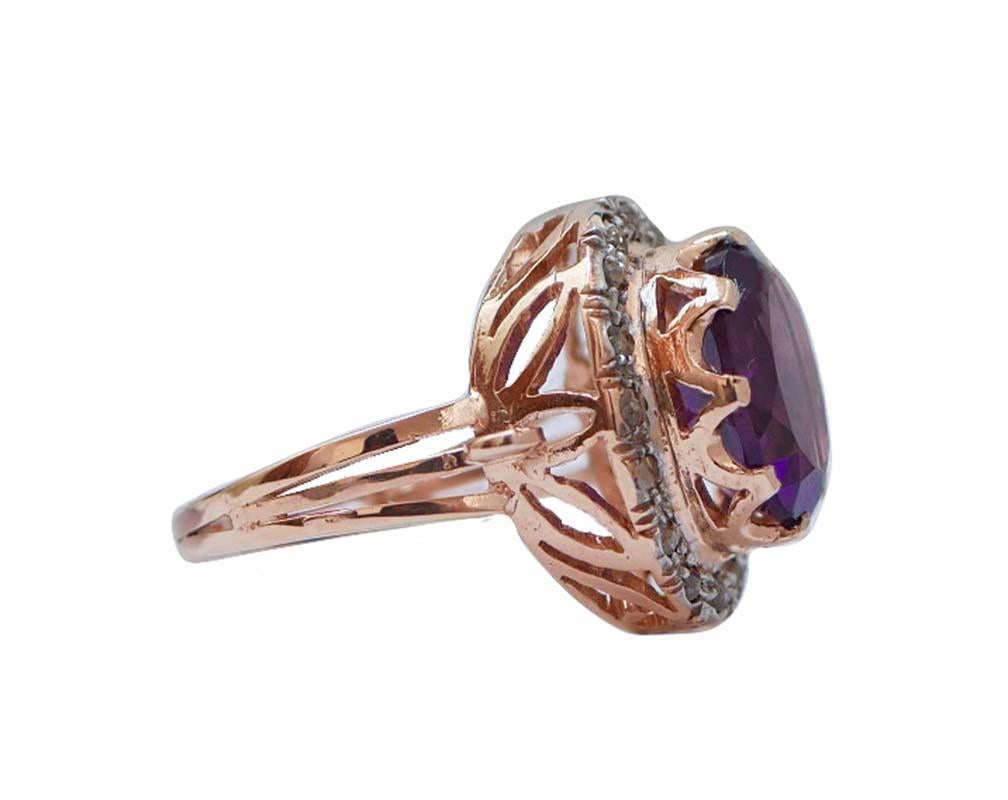Beautiful retro ring in 9k rose gold and silver structure mounted with a central amethyst surrounded by a crown of diamonds.
This ring is totally handmade by Italian master goldsmiths and it is in perfect conditions.
Diamonds 0.54 ct
Amethyst 4.89