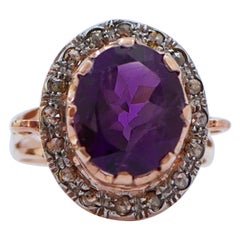 Anello con ametista, diamanti, oro rosa e argento.