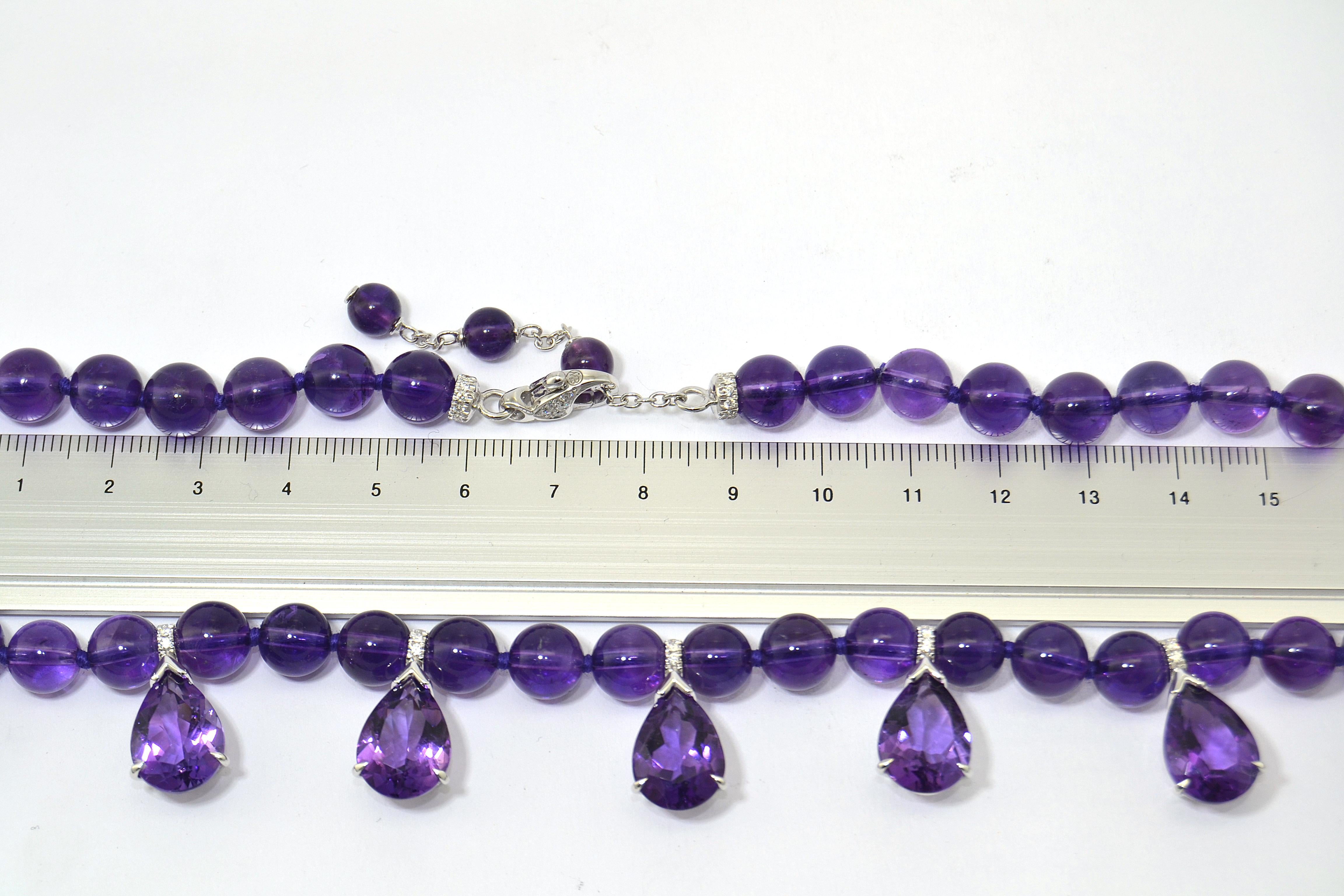 The necklace features 5 faceted drops of amethyst and diamonds mounted in 18 kt white gold decorating a strand of amethyst balls
Soft, light, comfortable, easy and chic at a time.
Length is adjustable to fit any neck and outfit.
Please note that