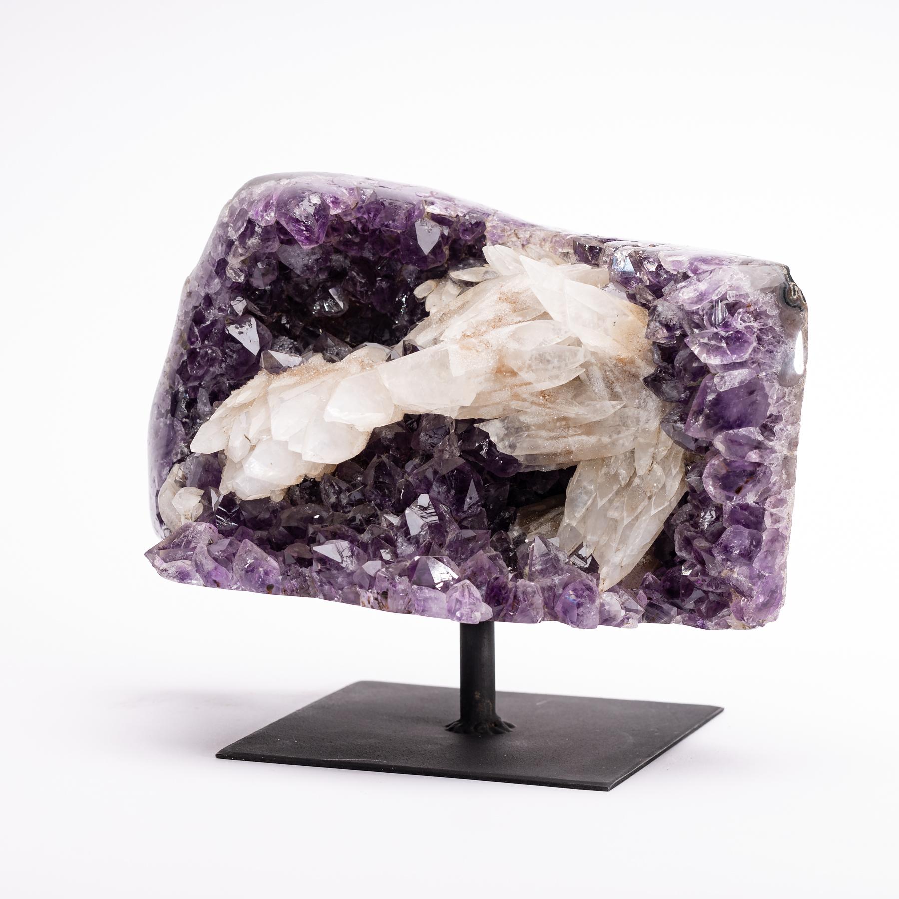 Deep purple amethyst with white calcite Brazilian specimen mounted on a metal stand.
  
