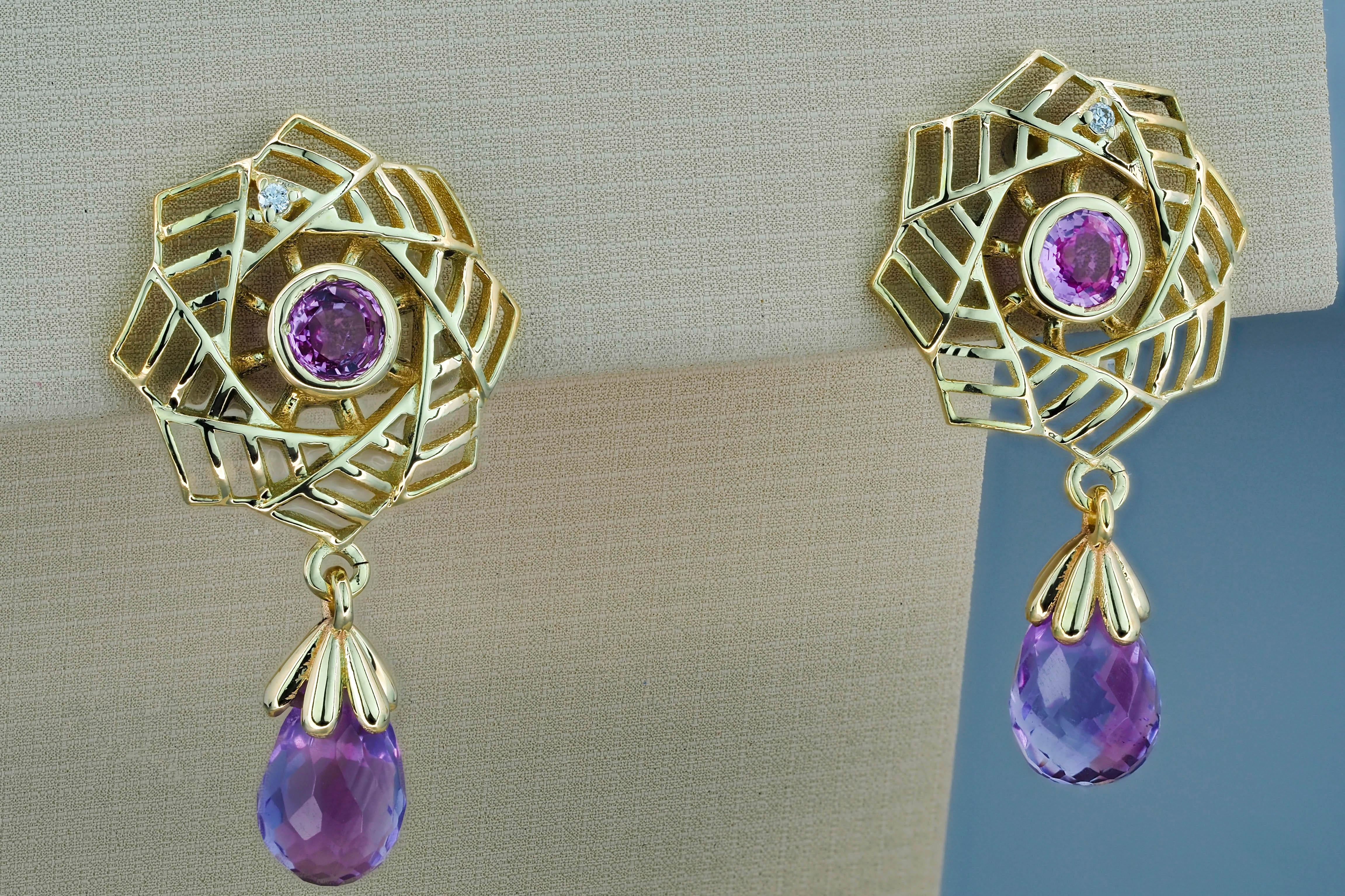 14k gold earrings with amethyst, sapphires and diamonds. Amethyst earrings in 14k gold. Pink sapphire earrings in 14k gold. 

Material: 14k gold
Weight: 2.80 g.
Earrings size: 25 x 14 mm
Amethyst:
2 pieces, lavender - violet - color, briolette cut,