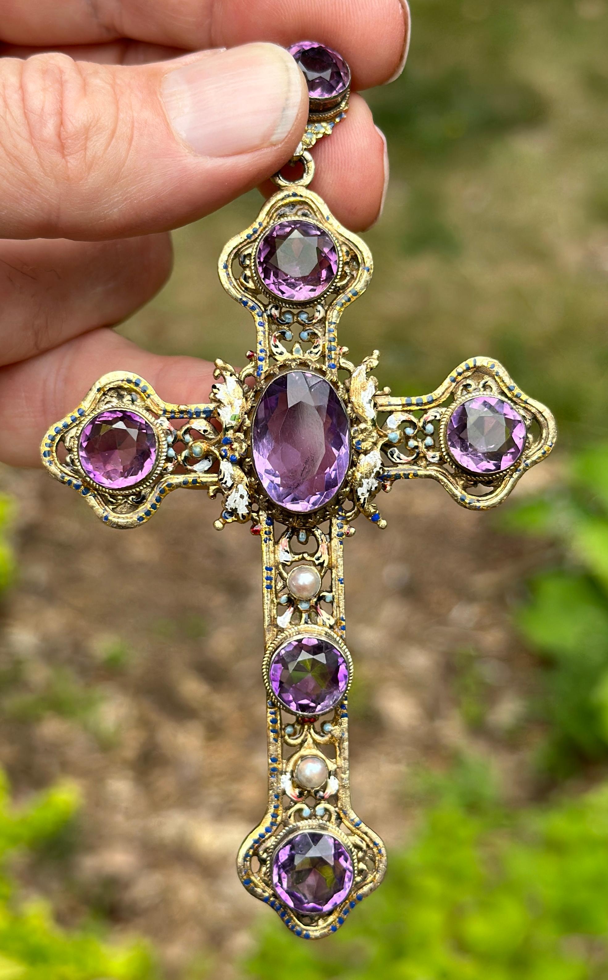 Indulge in a magnificent Museum Quality Austro-Hungarian 20 Carat Amethyst, Enamel and Pearl Cross Pendant of a monumental 4 3/4 inches by 2 3/4 inches.  The cross is in the Renaissance Revival style and dates to circa 1870.  It is hallmarked with