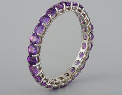 Amethyst eternity ring in 14k gold.