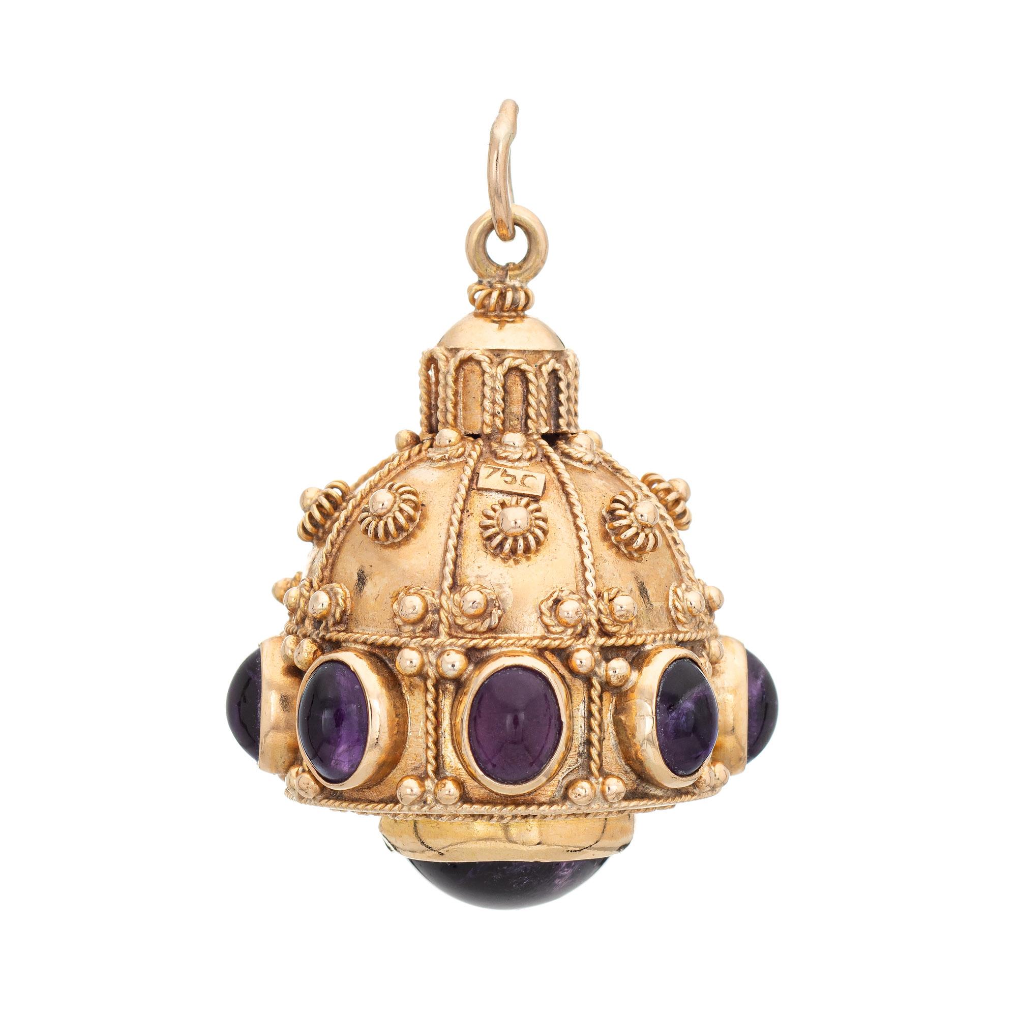 Finely detailed vintage large Etruscan style gemstone charm crafted in 14k yellow gold (circa 1950s to 1960s).  

8 cabochon cut pieces of amethyst measure 4.5mm x 3.5mm (estimated at .30 carats each - 2.40 carats estimated). The base of the charm