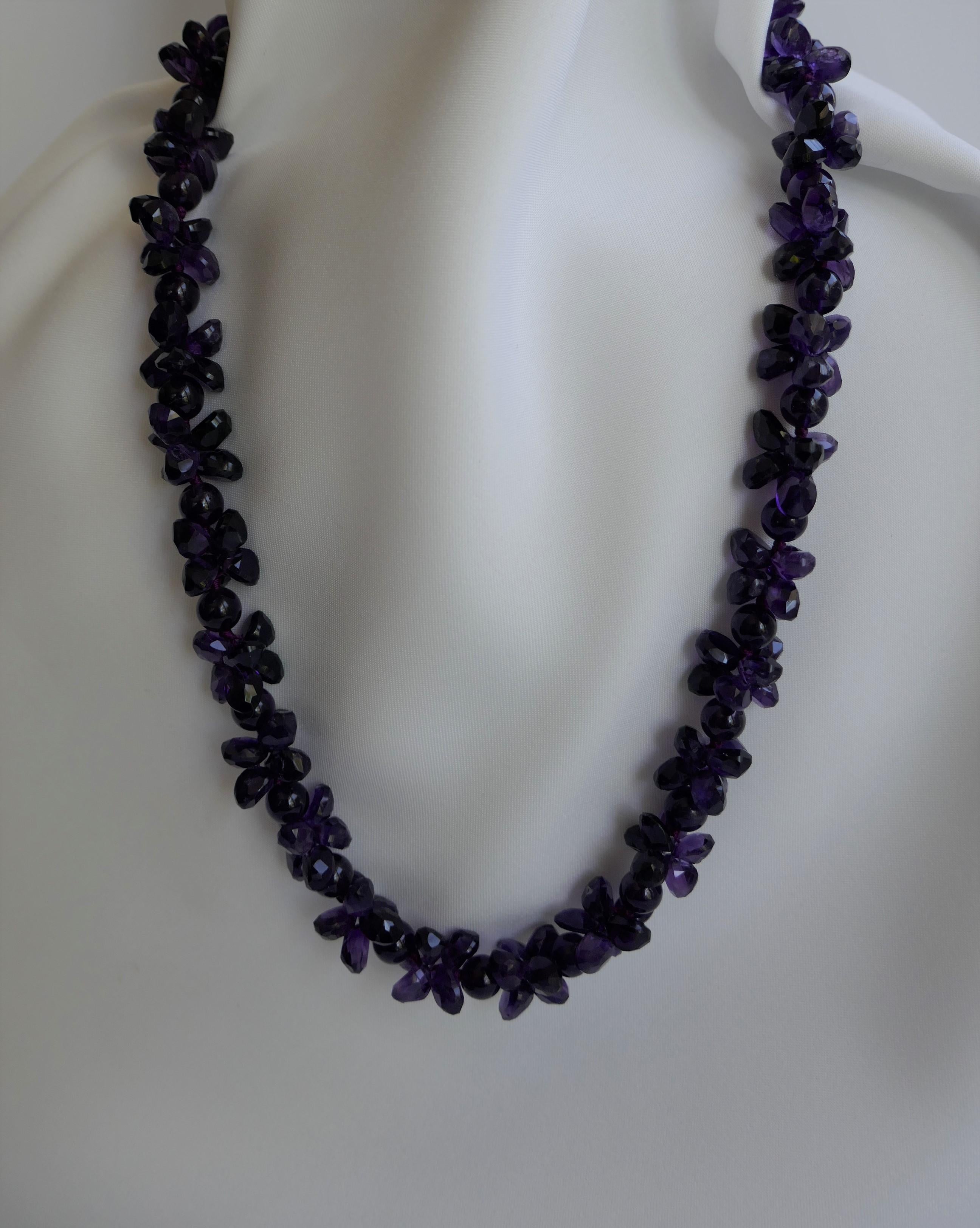 You really cant appreciate the amethyst stones in this necklace. The photograph too dark but the necklaces is stunning!!!! This amethyst necklace has two amethyst shaped stones round and faceted briolettes. It has an exclusive 925 oxidized sterling