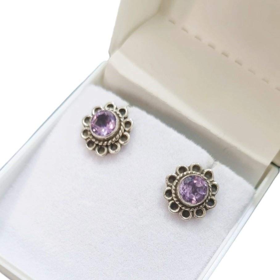 Metal - Sterling silver
Gross Weight - 7.35 Grams
Gemstones - Natural Amethyst

Introducing our stunning natural amethyst stud earrings in elegant sterling silver, inspired by the delicate beauty of a blooming flower. These earrings feature genuine