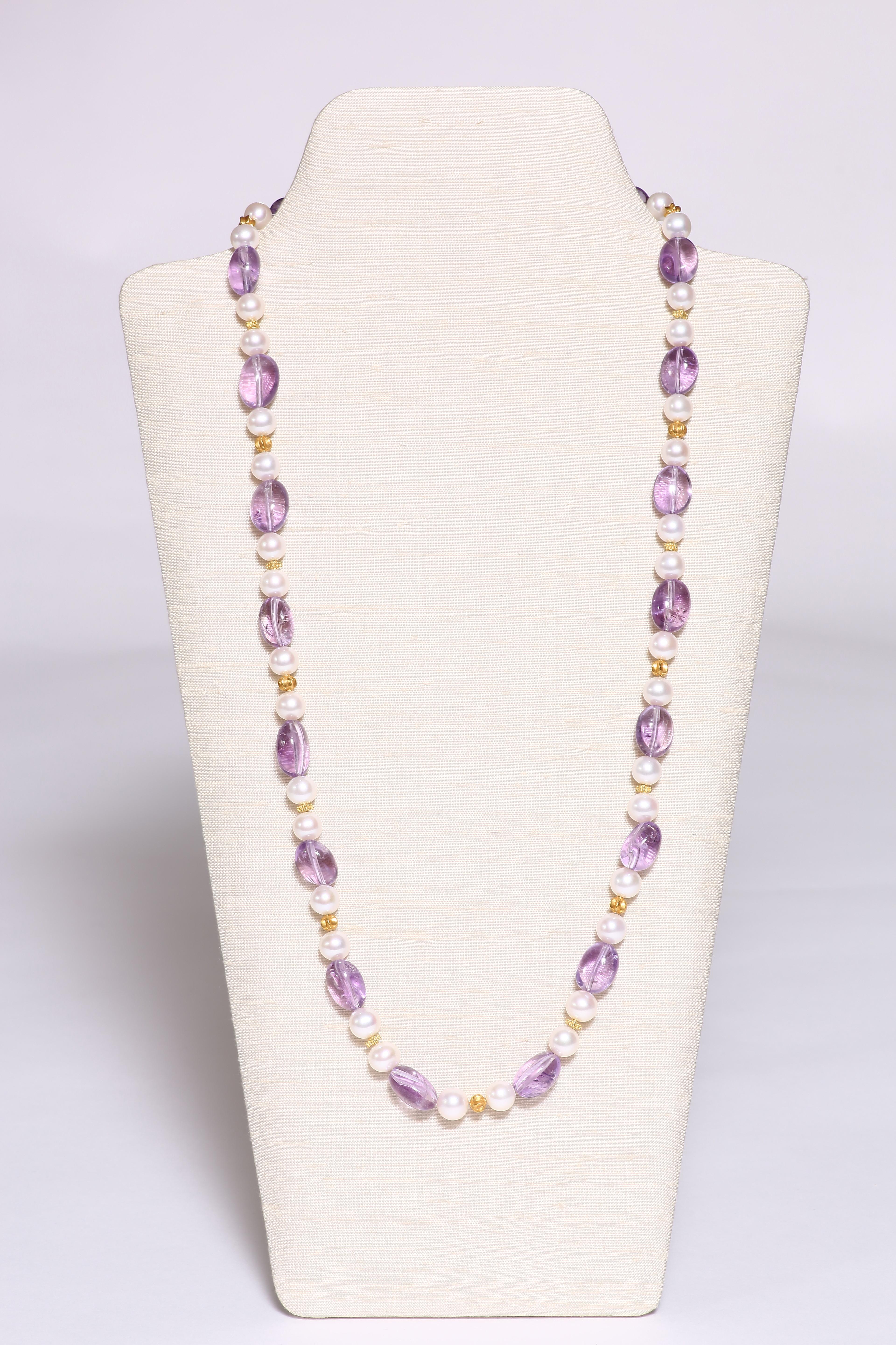 Perfect for summer. The clear light violet oval-shaped amethyst beads are spaced by two freshwater pearls and a small 18k faceted gold bead. The 31