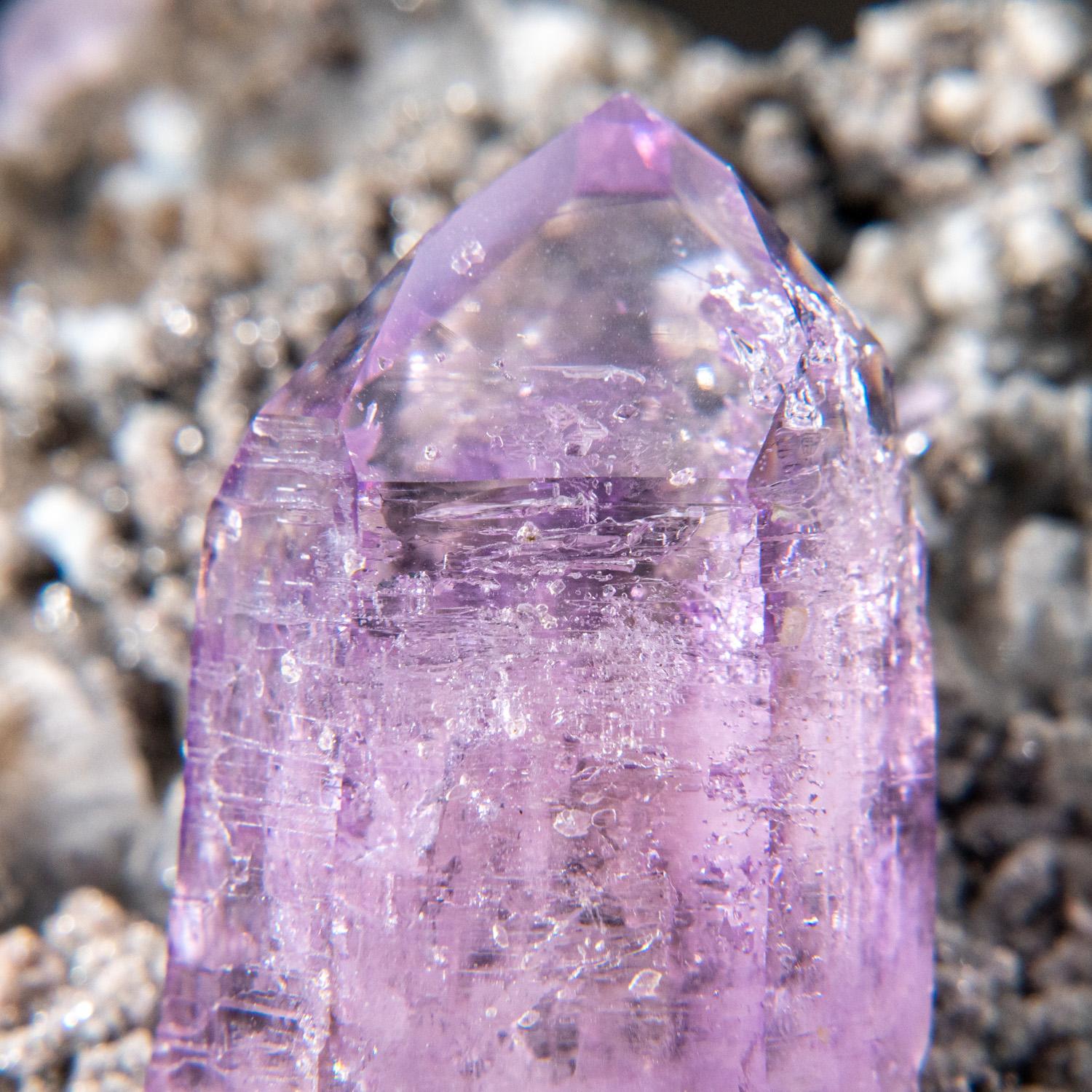 Beautiful specimen from Piedra Parada, Las Vigas de Ramirez, Veracruz, Mexico.

Transparent purple amethyst quartz crystal with lustrous crystal surfaces and rich purple color with well defined phantom zoning. The crystal fully terminated with