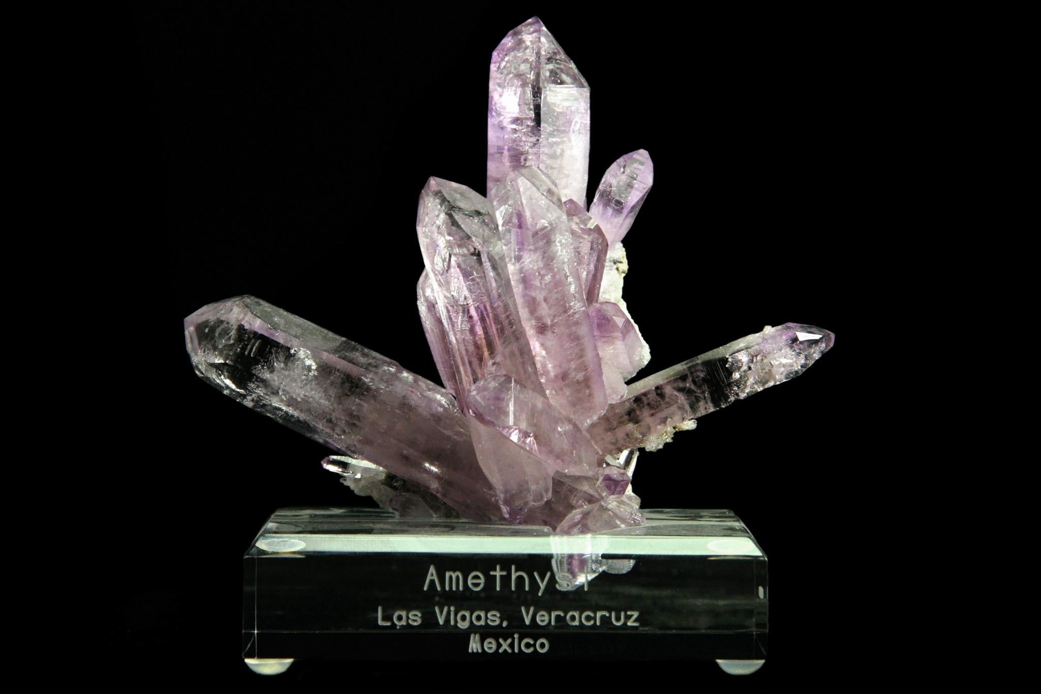 From Piedra Parada, Las Vigas de Ramirez, Veracruz, Mexico

 

Lustrous sharp terminated cluster of Amethyst crystals shooting out in every direction. Has an even medium purple color throughout the crystals with a high glassy luster. Crystals are