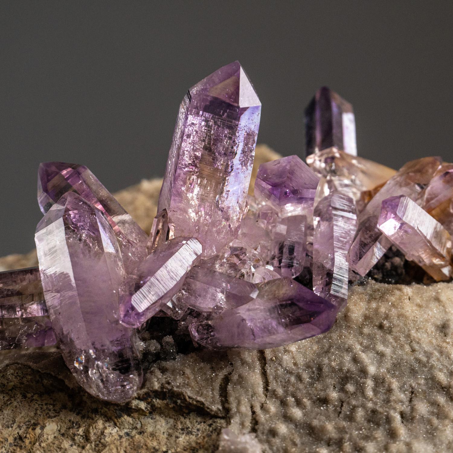 Beautiful specimen from Piedra Parada, Las Vigas de Ramirez, Veracruz, Mexico. Parallel formation of amethyst crystals with great transparency and rich purple color with well defined phantom zoning. The crystals are fully terminated with lustrous