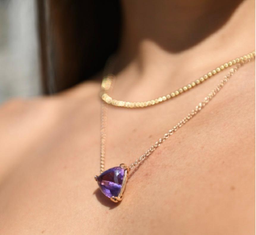 This is a necklace made of a 16 carat amethyst with 10 grams of rose gold18k, the amethyst has a pentagon cut and is all made by hand in Milan, Italy.
