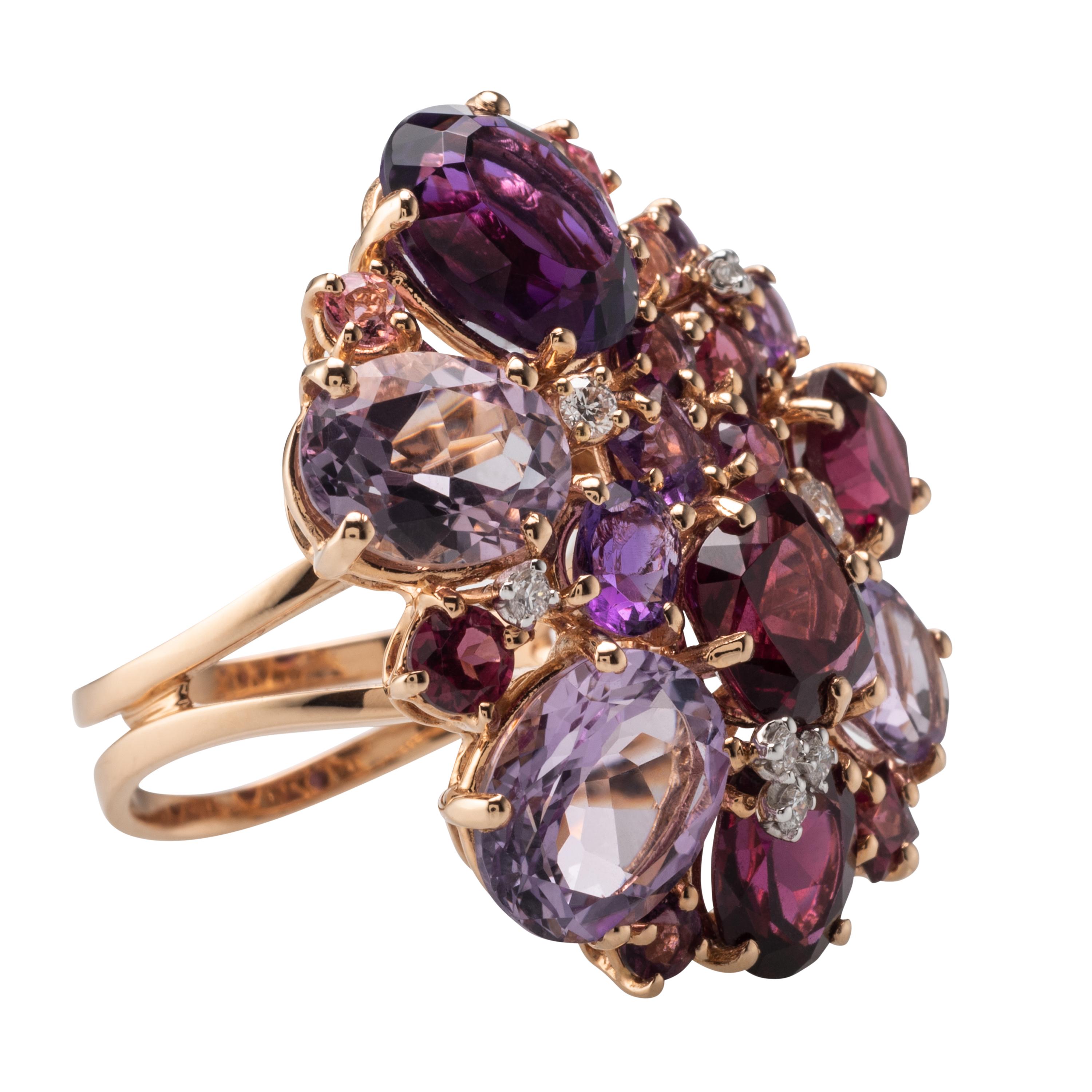 This Ring features Amethysts, Garnets and Diamonds. Produced in Italy.
Gemstones 15.5 Carat, Diamonds 0.18 Carat. 
Ring can be resized upon request.