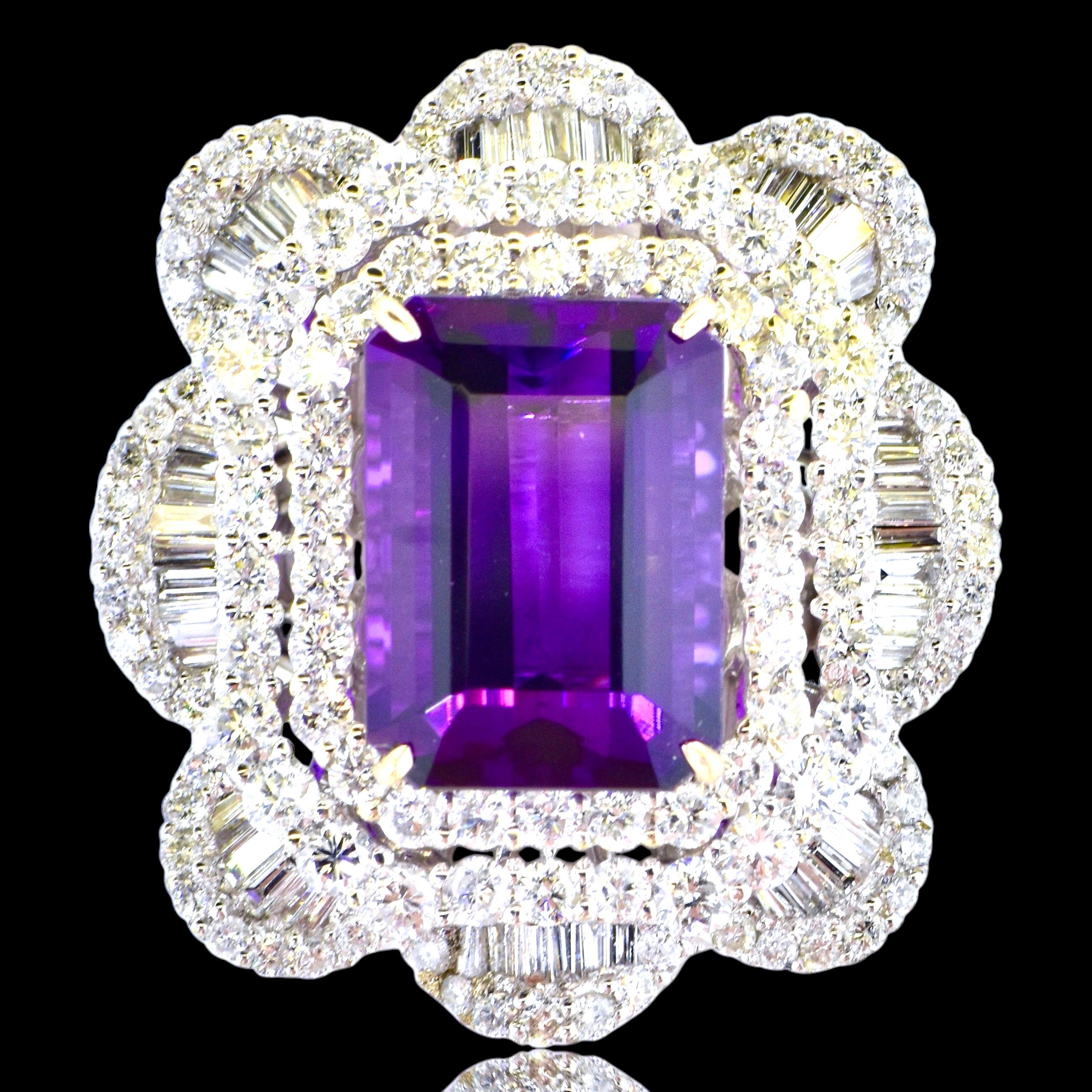 Amethyst and Diamond Large and Important 18K White Gold Ring.
This is a large, 1.25 inches vertically, by 1 - 1/8th inch ring that possesses a complex white on white design and that centers a 9.5 ct. emerald cut gem amethyst of vivid purple color.