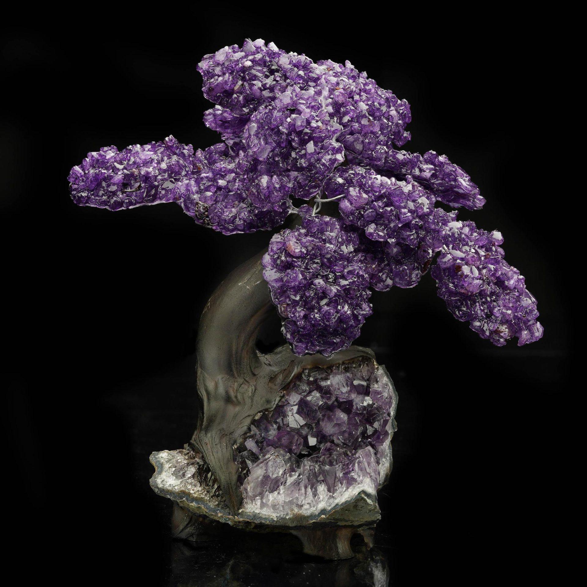 This exquisite handcrafted Amethyst gem tree brings harmony, beauty, and a touch of natural elegance to any space. Each “branch” is adorned with rich purple polished Amethyst crystals that shimmer with light, wired with care to create a lush,