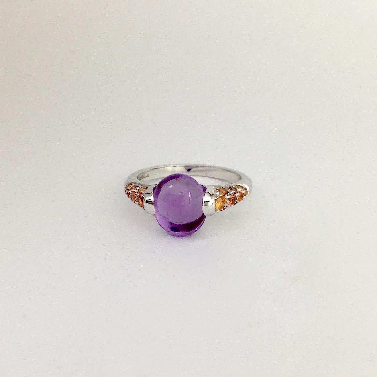 Made in Italy Amethyst Gemstone Orange Sapphire 18 Karat White Gold Ring
This ring in white gold has an amethyst cabochon cut and along the side there are a total of 0.49 ct of orange sapphires.
This ring was designed in my workshop in Verona,