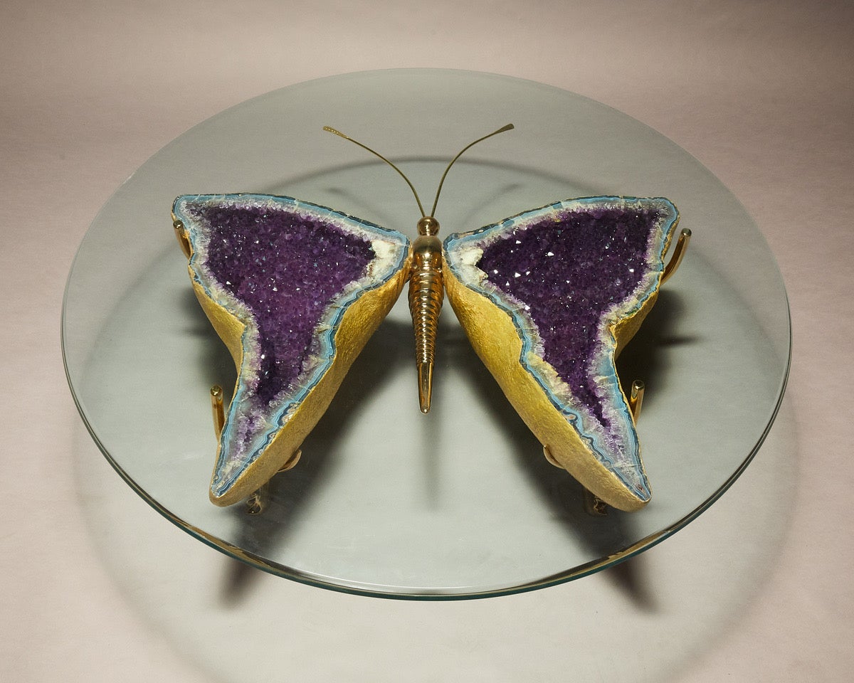 Butterfly coffee table made of pair of wing shaped natural Brazilian amethyst gold leafed in 22K gold and set on a solid bronze base like a piece of custom jewelry .
Designed and made by Gallery Girasole.
Table base is approximately 46