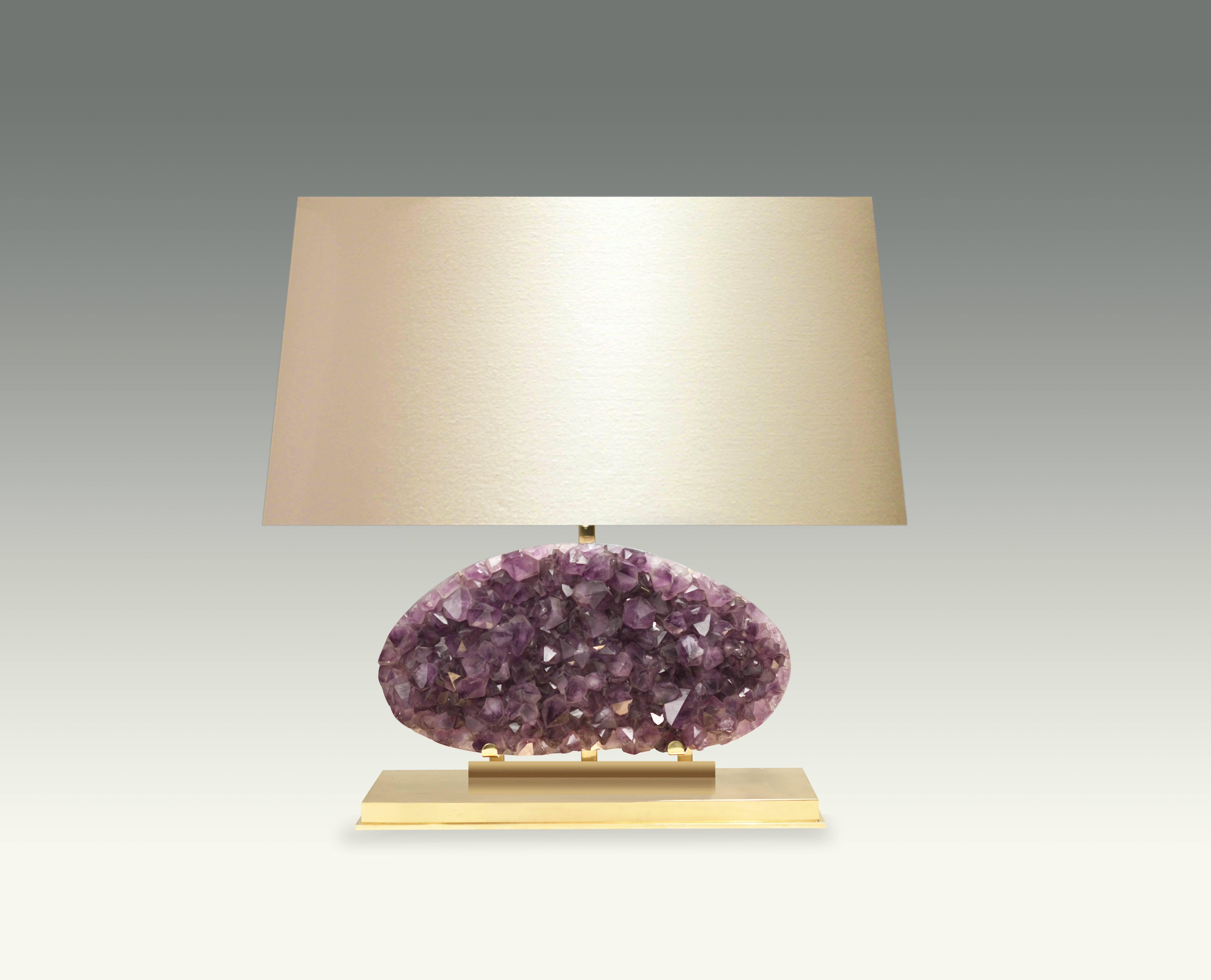 Amethyst geode cluster lamps. Mount is the lamp and the base is polished brass. Created by Phoenix Gallery NYC.

For more Rock Crystal lightings and accessories from Phoenix gallery, please search 