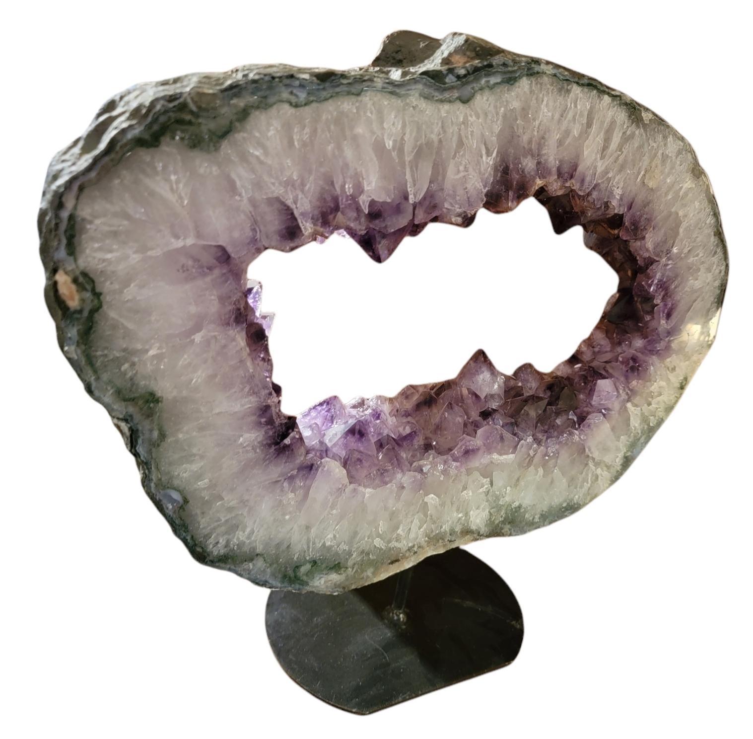 Amethyst Geode Stone on Iron Stand measurements are approx 18 w x 15 high x 5.5 deep with stand 15.5 high and base diameter is 8.