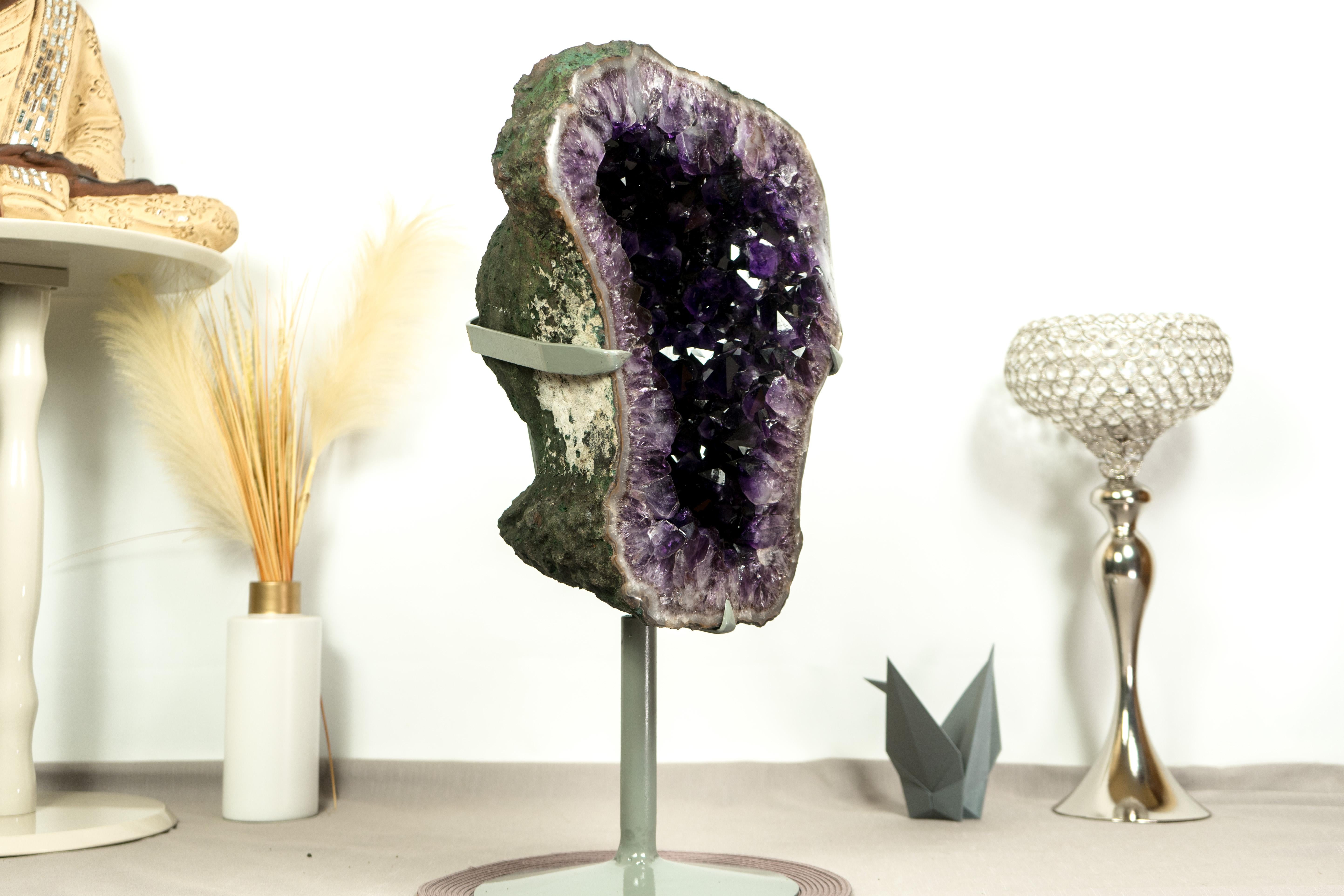 Spectacular! This Amethyst Geode is one of the most aesthetically pleasant Amethyst Geodes we have had the chance to work with. With elegant grandeur, this rare amethyst is ready to become a centerpiece at a gallery, museum, or in your decor,