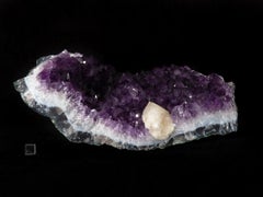 Amethyst geode with calcite