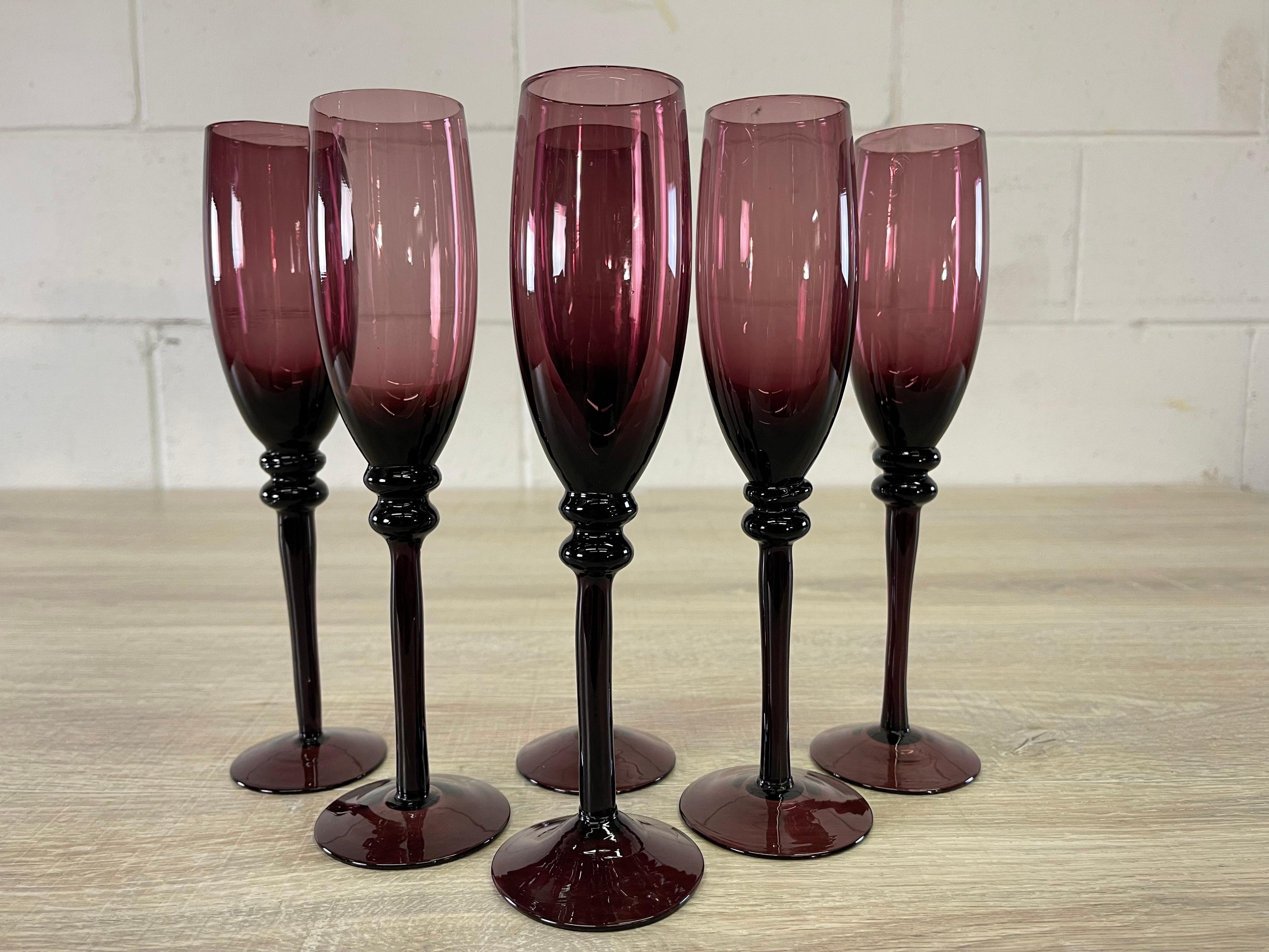 Vintage set of six amethyst glass champagne flutes. Hand blown. No marks.
