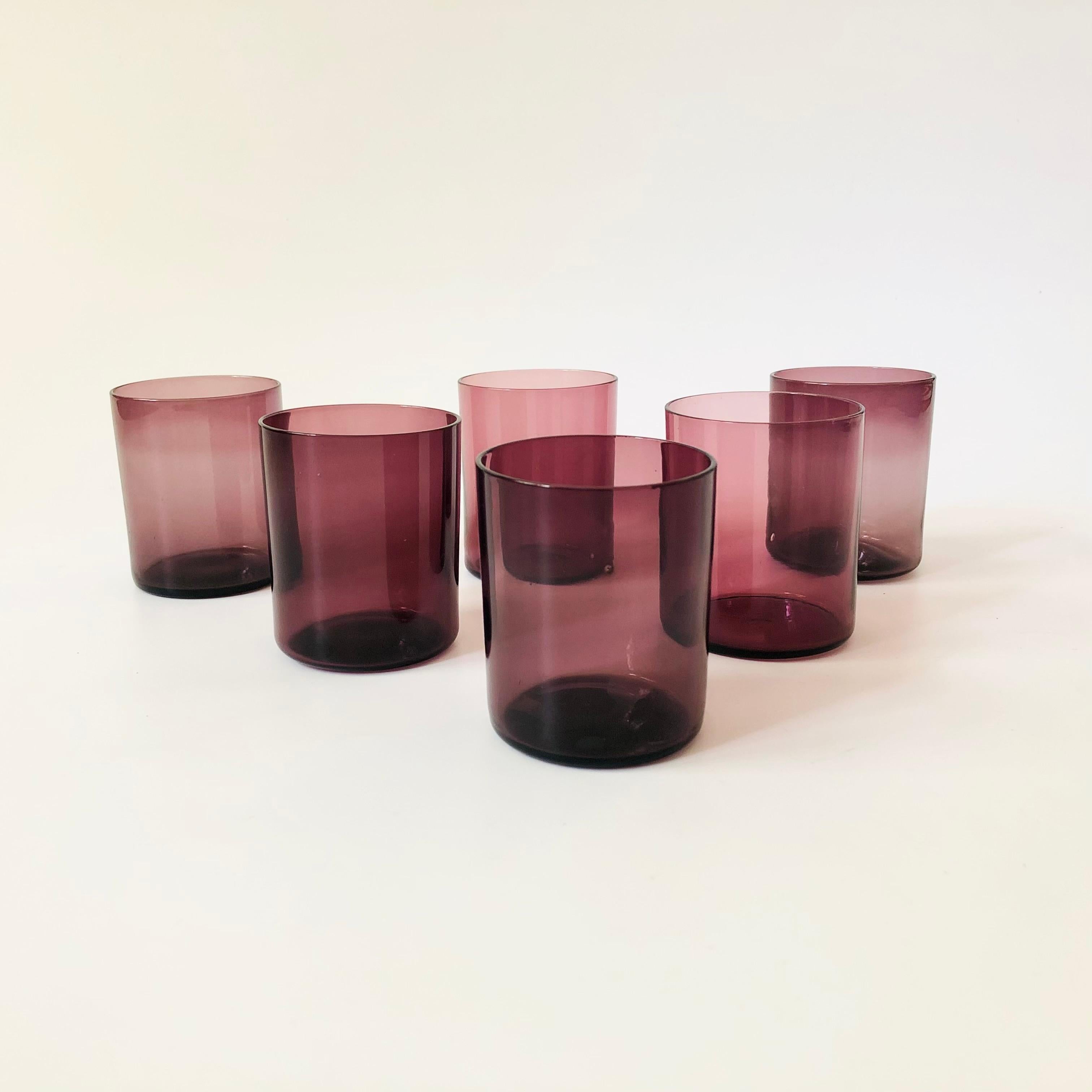 A set of 6 vintage cordials made out of moody amethyst colored glass. Nice minimalist cylinder shapes.


