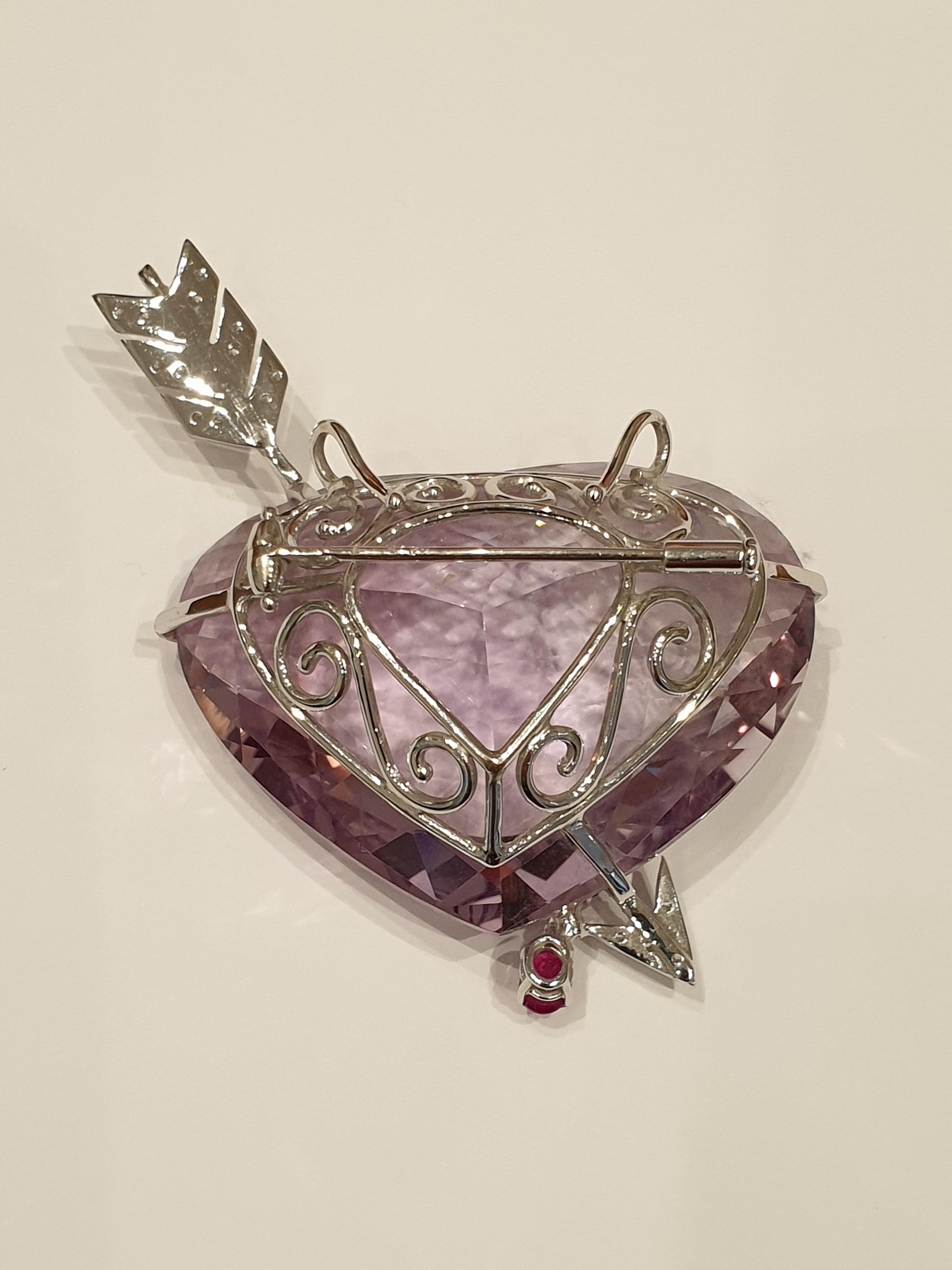 Brilliant Cut Amethyst Gold Brooch in the Form of a Pierced Heart with Diamonds and Rubies