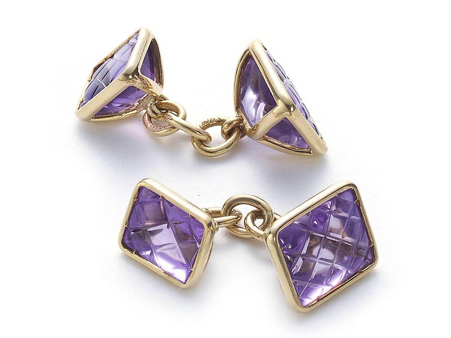 A pair of amethyst double sided cufflinks, with with larger and smaller, cross-hatched, amethysts, giving a quilted appearance, mounted in 18ct gold, with chain fittings. In a Parsons The Jewellers Ltd. box, Bristol. Circa 1930.