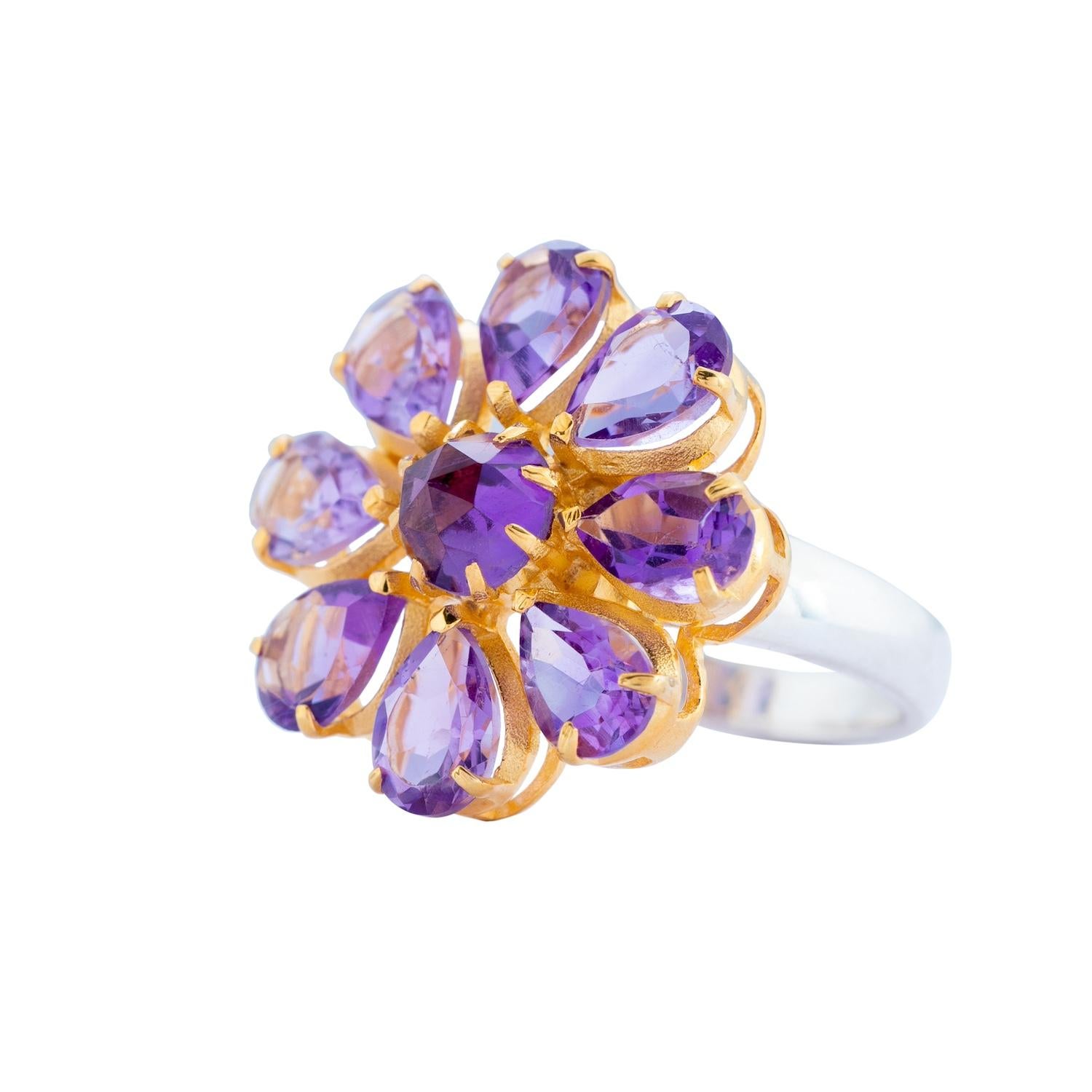 

This striking amethyst ring is limited edition and handmade in our workshops. We have used hand-cut pear shaped amethysts and made the ring in sterling silver, with a gold micron plated top. The ring has exquisite jaali work on the back. 

You