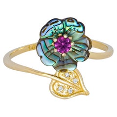 Purple gemstone gold ring.