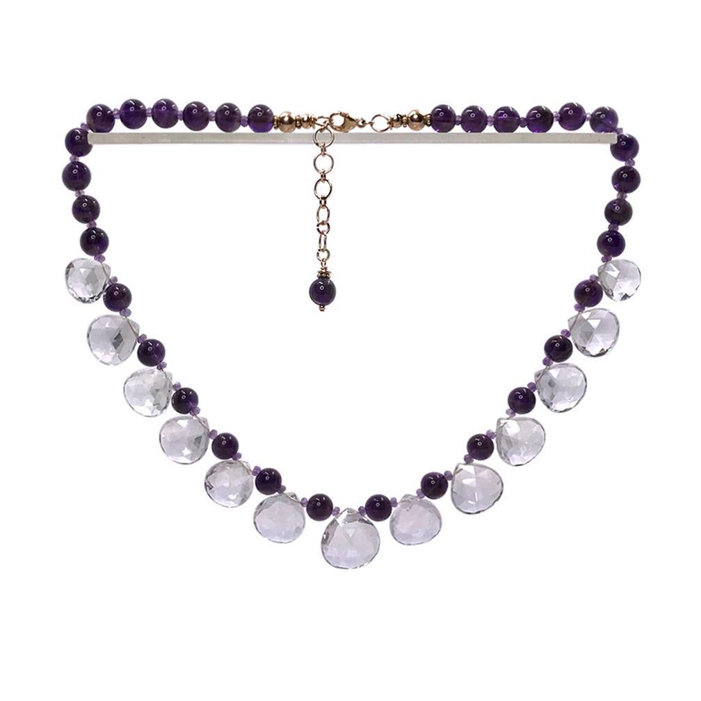 This is an amethyst heart briolettes bib necklace. It was created with up to 18mm faceted transparent pink amethyst heart briolettes, 8 mm smooth opaque amethyst beads and 2 mm faceted micro amethysts along with rose gold-filled components and a 1.5