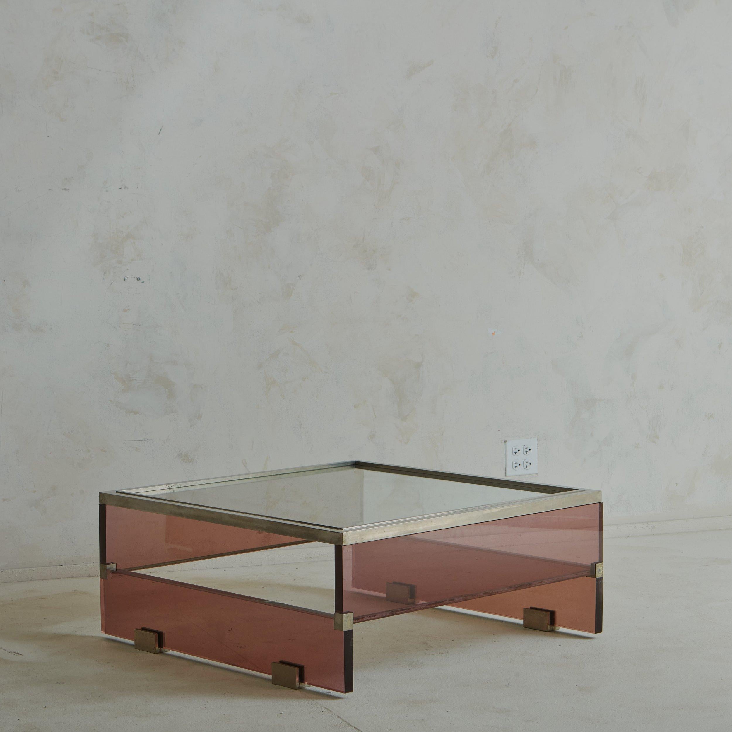 A 1970s French lucite coffee table set apart by its deep amethyst color. Sourced along the Cote D’Azur, we imagine this was a custom piece designed specifically for an estate along the French Riviera during the 1970s. This table has interlocking