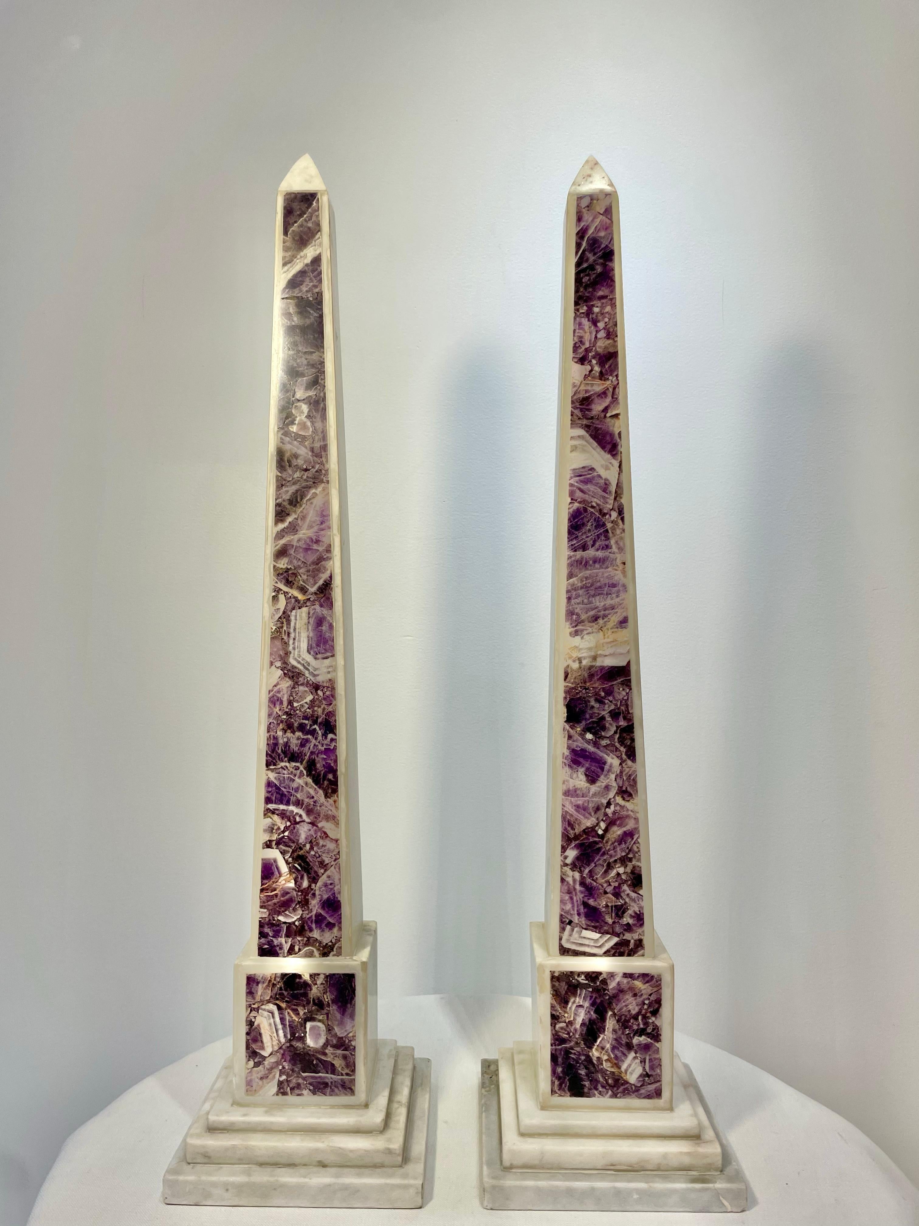Pair of 19th-century tall and imposing white marble obelisks with the unusual addition of amethyst inlaid onto the front panels. Italian circa 1890


