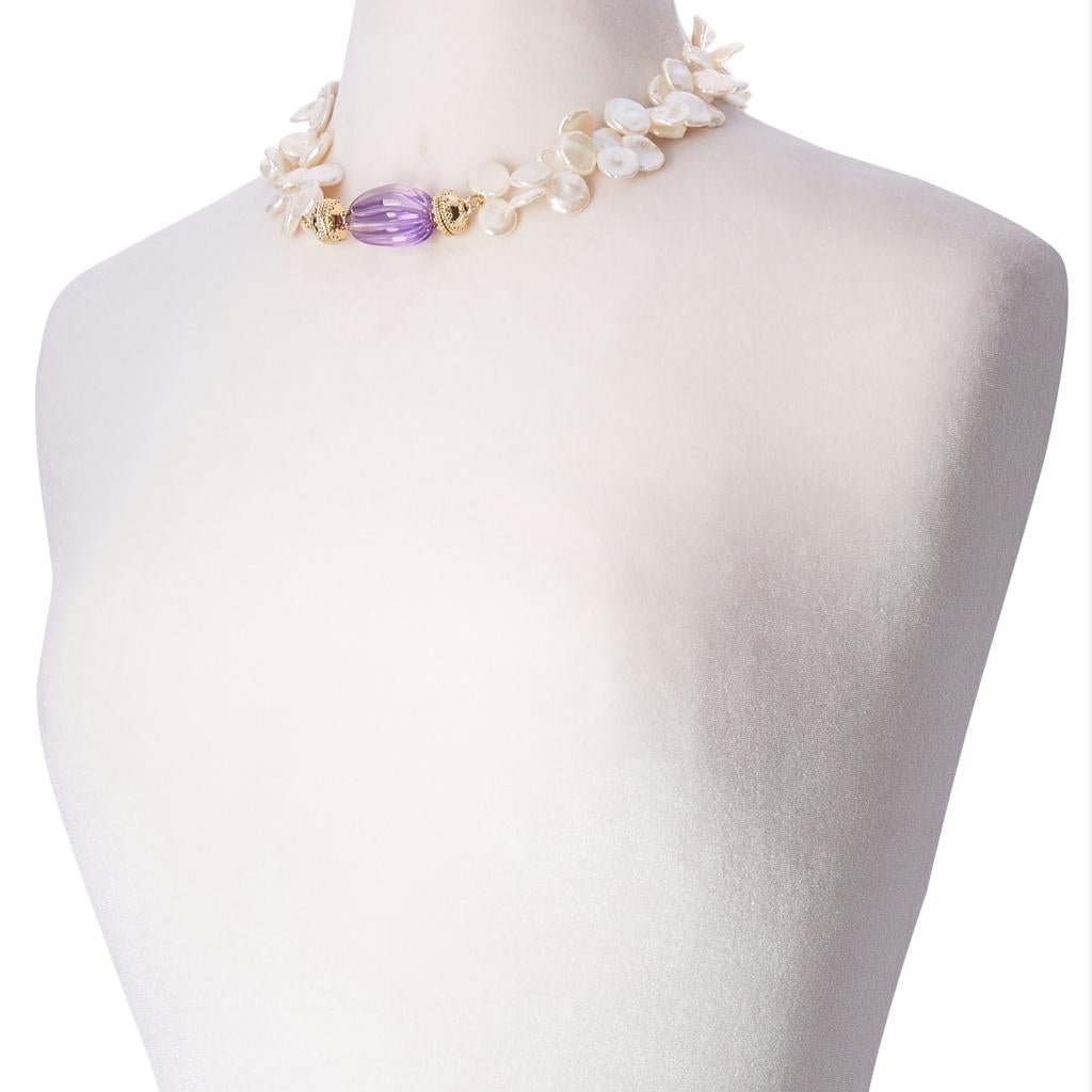 Beautiful carved amethyst melon centerpiece with 14K plated yellow gold magnetic clasps. 

Create the perfect look by pairing this centerpiece with any magnetic Clara Williams necklace, or necklace and tassel combination. 

Measurements: 1.5 inches