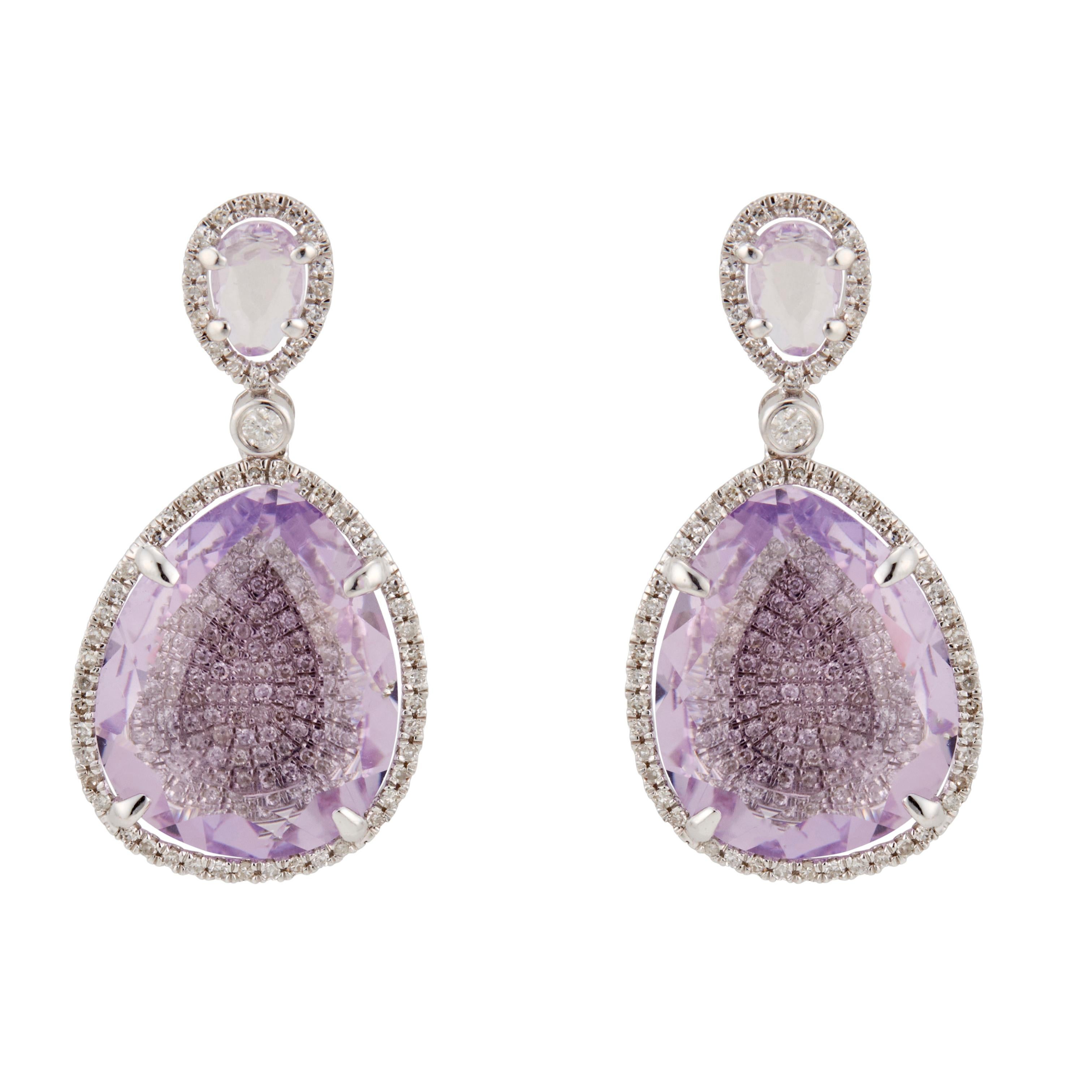 Amethyst and diamond halo dangle earrings. 4 pear shaped amethyst set in 14k white gold with round diamond halos.

2 pear shaped purple Amethyst, approx. total weight 7.80cts, 6.28 x 4.10 x 1.62mm
2 pear shaped purple Amethyst, approx. total weight