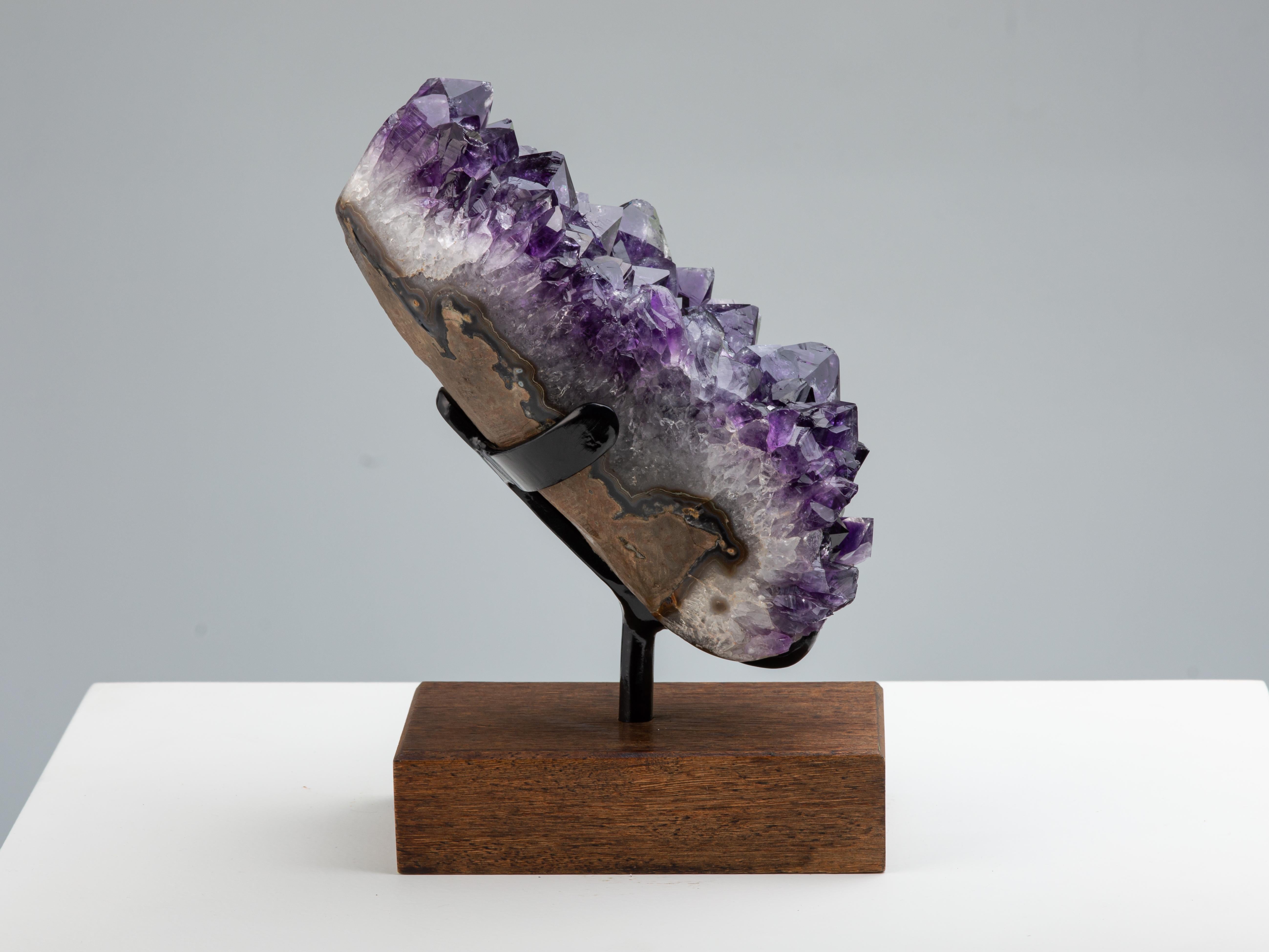 South American Amethyst Mineral Specimen with High Crystal Peaks on Wooden Stand For Sale