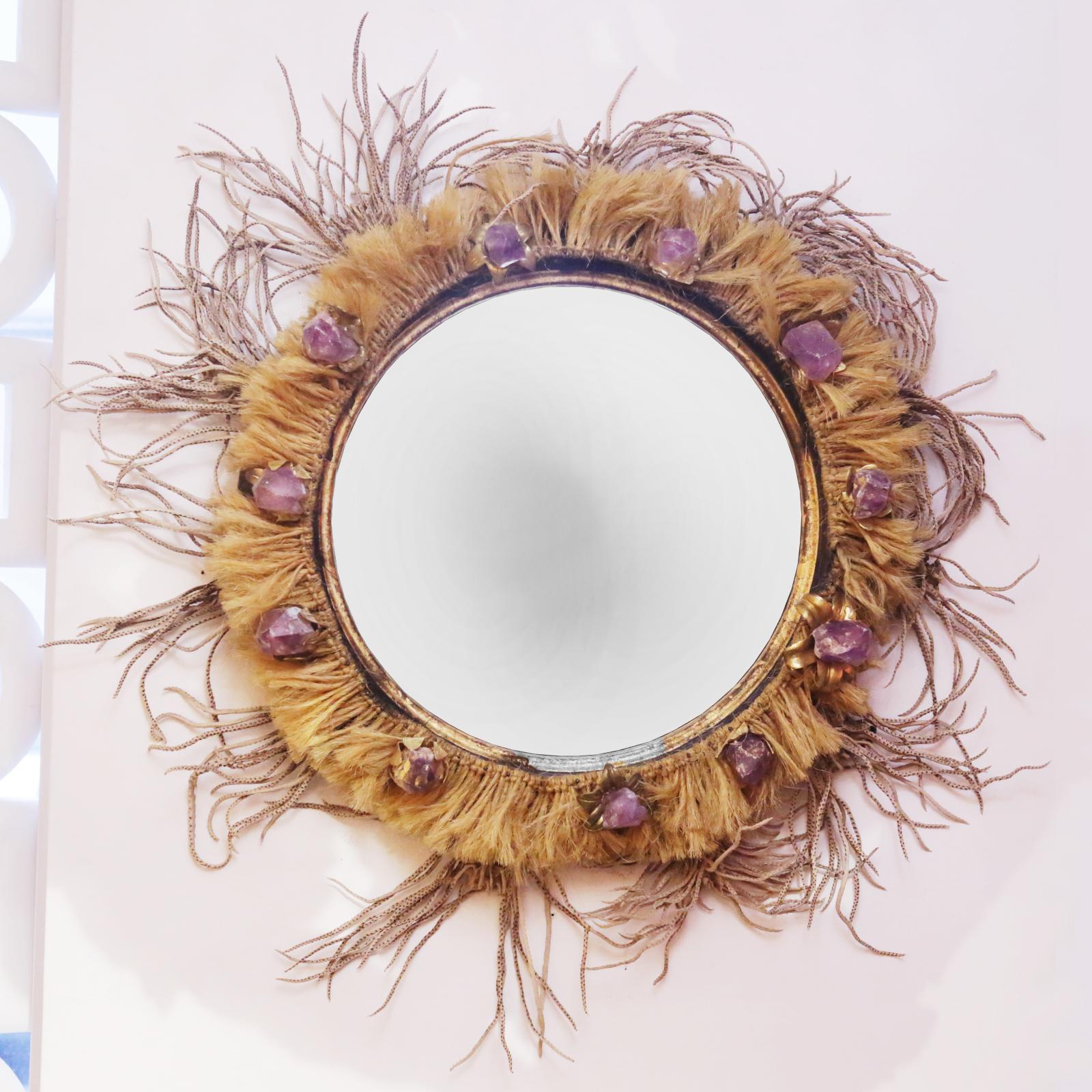 Mirror amethyst with frame in solid wood
in vintage gold finish, surrounded with pure
amethyst stones from Brazil and with natural
vegan lianes. With convex mirror glass.
Exceptional and unique piece.
Made in France in 2019.