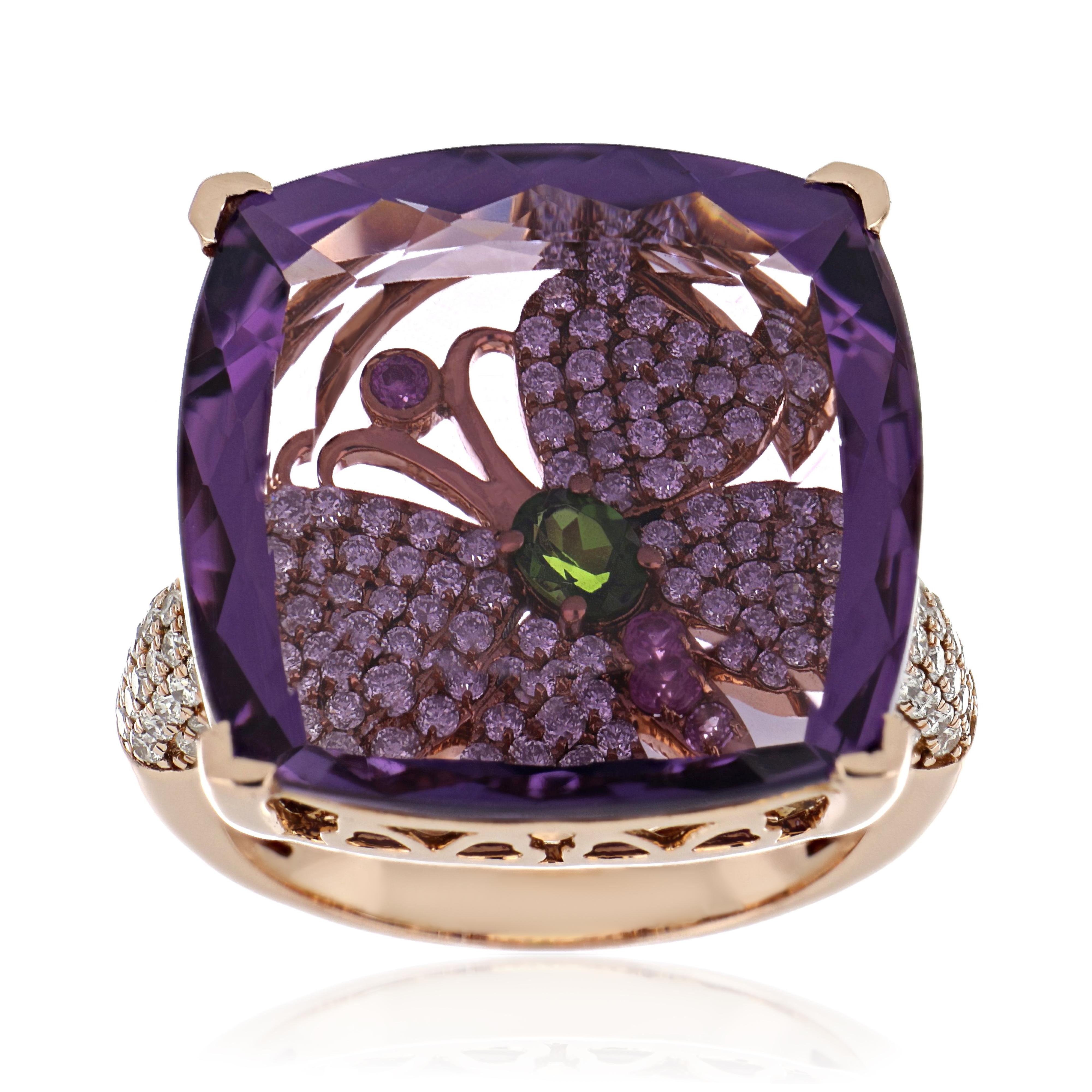 14 Karat Rose Gold ring studded with Cushion Cut  19.45 Ct  Amethyst,  with unique under stone setting of 0.20 Ct Chrome Diopside and 0.05 Ct Pink Sapphire  accented with 0.88 Cts Diamond Beautifully hand crafted in 14 Karat Rose Gold.

Stone