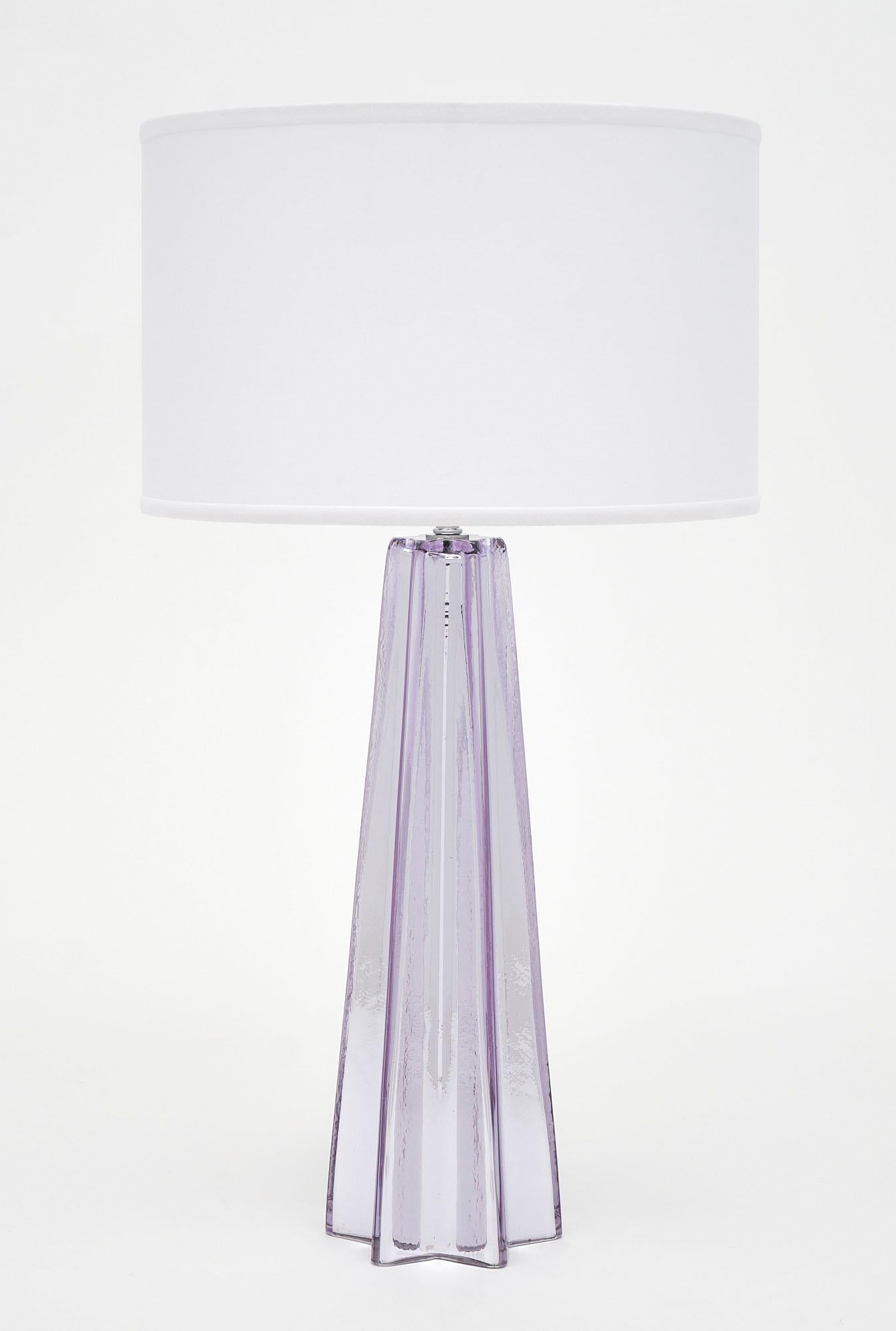 A sparkling pair of hand-blown Murano glass table lamps with a beautiful amethyst tone. Mercury leafing overlaid with thick, amethyst glass. The height to the top of the glass is 18.5”. Newly wired to US standards.