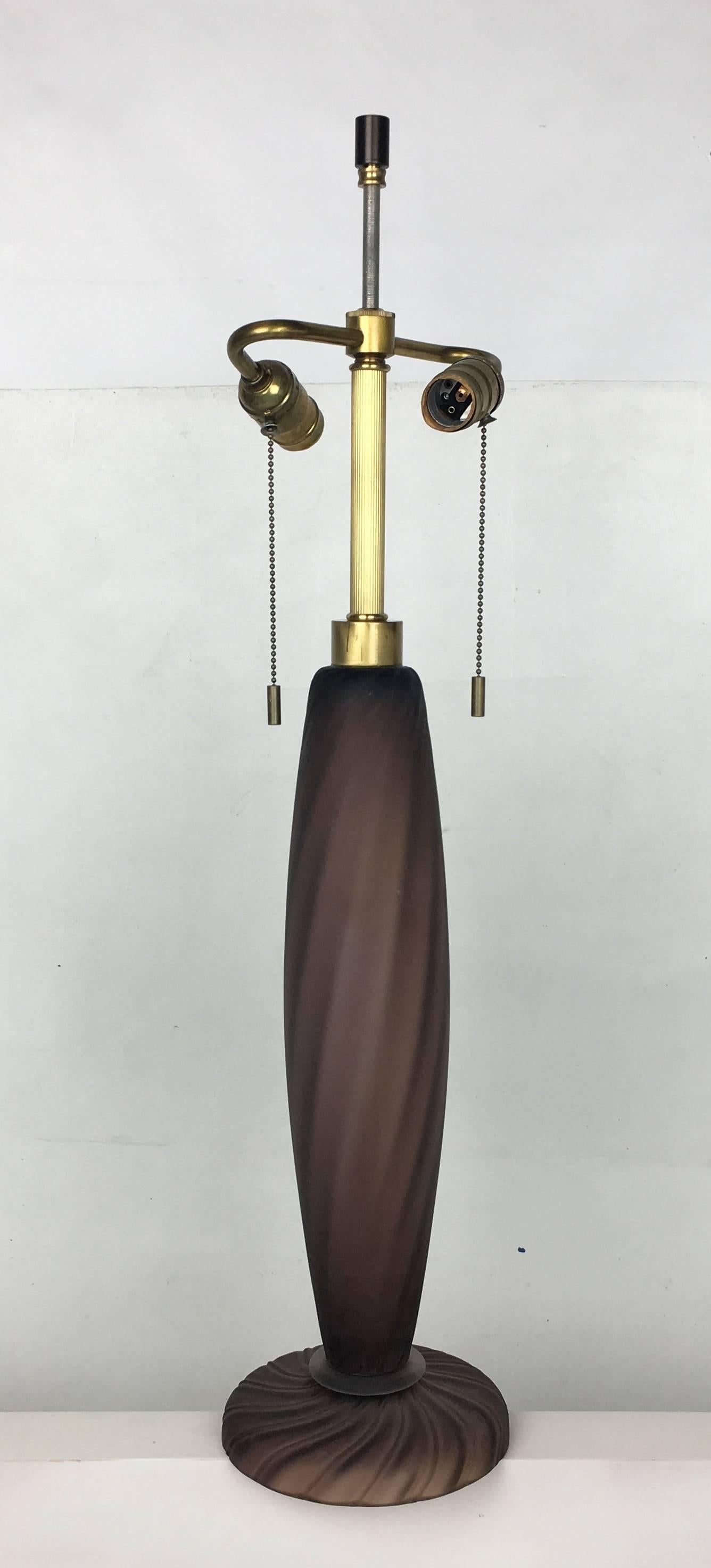 Beautifully rendered Murano Scavo glass Table lamp with brass mounts by John Hutton for Donghia. The spiraling ribbed body is raised on a pinwheel base. The lamp comes with a twisted Rayon cord and brass double cluster. The shade is for display only