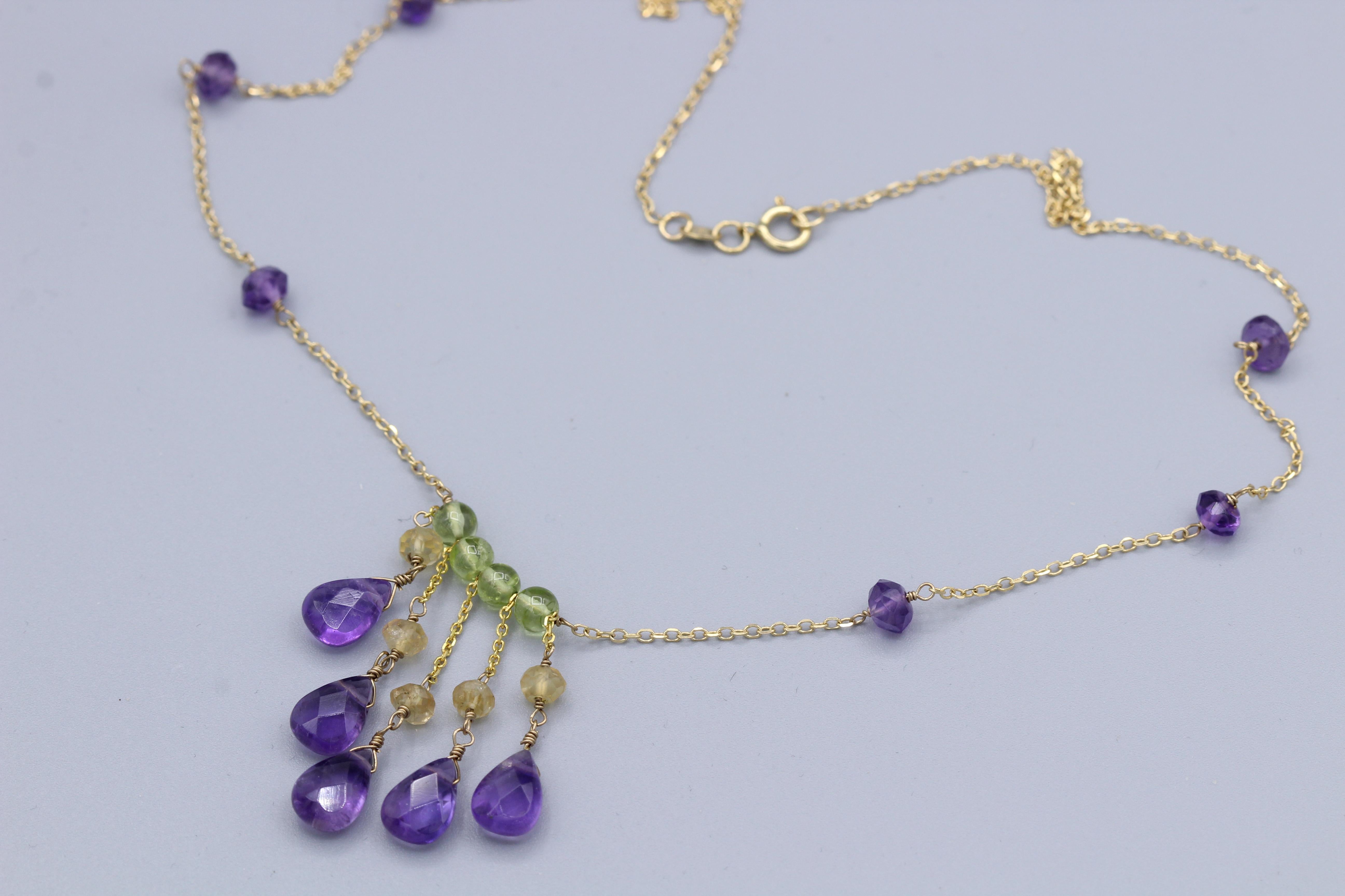 Elegant unique Dangling Beads Necklace
14k Yellow Gold & Wire style 
Length 16.5’ Inch
Dangle Length approx. between 1’ – 1.5’ inches
Natural Amethyst Drops approx.  10 x 6 mm plus 3.0 mm beads
Natural Peridot Beads approx. 4.0 mm 
Natural Citrine