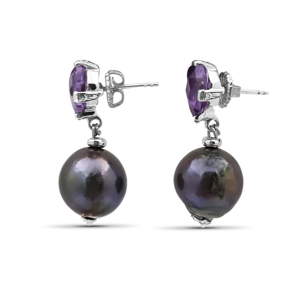 Amethyst & Peacock Pearl in Sterling Silver Drop Earring

Stephen’s heart and passion go into each Dweck design, as the placement of each stone and its connection to nature has meaning. While bold and opulent, his jewelry has a weightless elegance