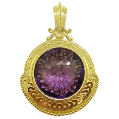 Pendentif en améthyste serti dans des montures en or 18 carats