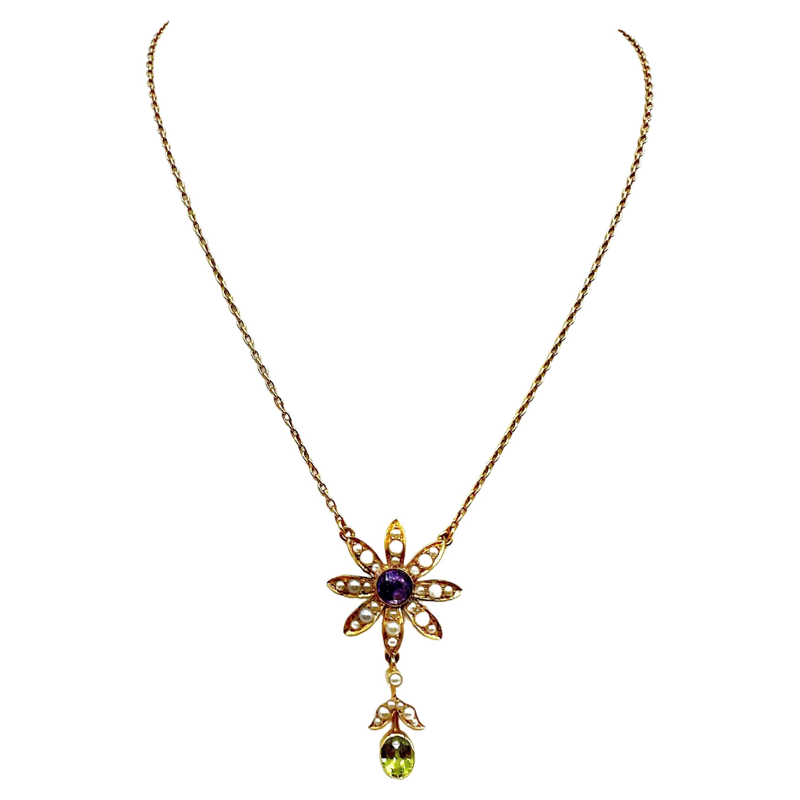  This stunning  floral pendant necklace is modern but also classic vintage. The necklace is from the early 1900's and replicates a beautiful flower with petals adorned in tiny seed pearls. The center is a round faceted amethyst and the bottom petal