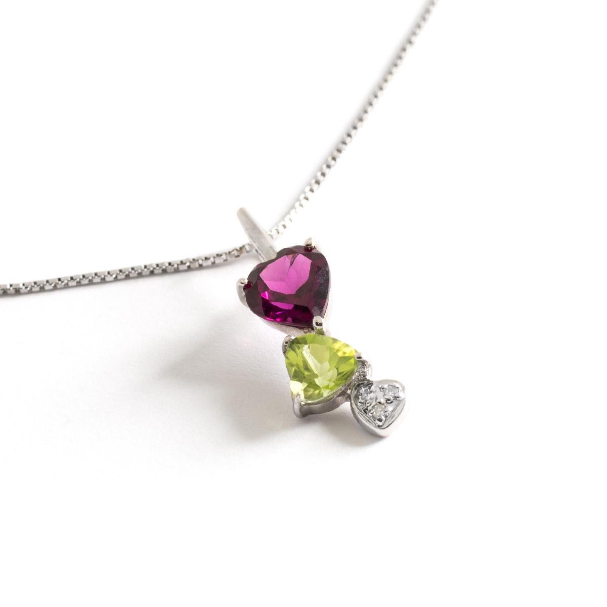 Amethyst heart shape length: 5.39 millimeters.
Peridot heart shape length: 5.68 millimeters.
Pendant length: 2.00 centimeters.
Chain length: approximately 43.00 centimeters.
Gross weight: 2.96 grams.